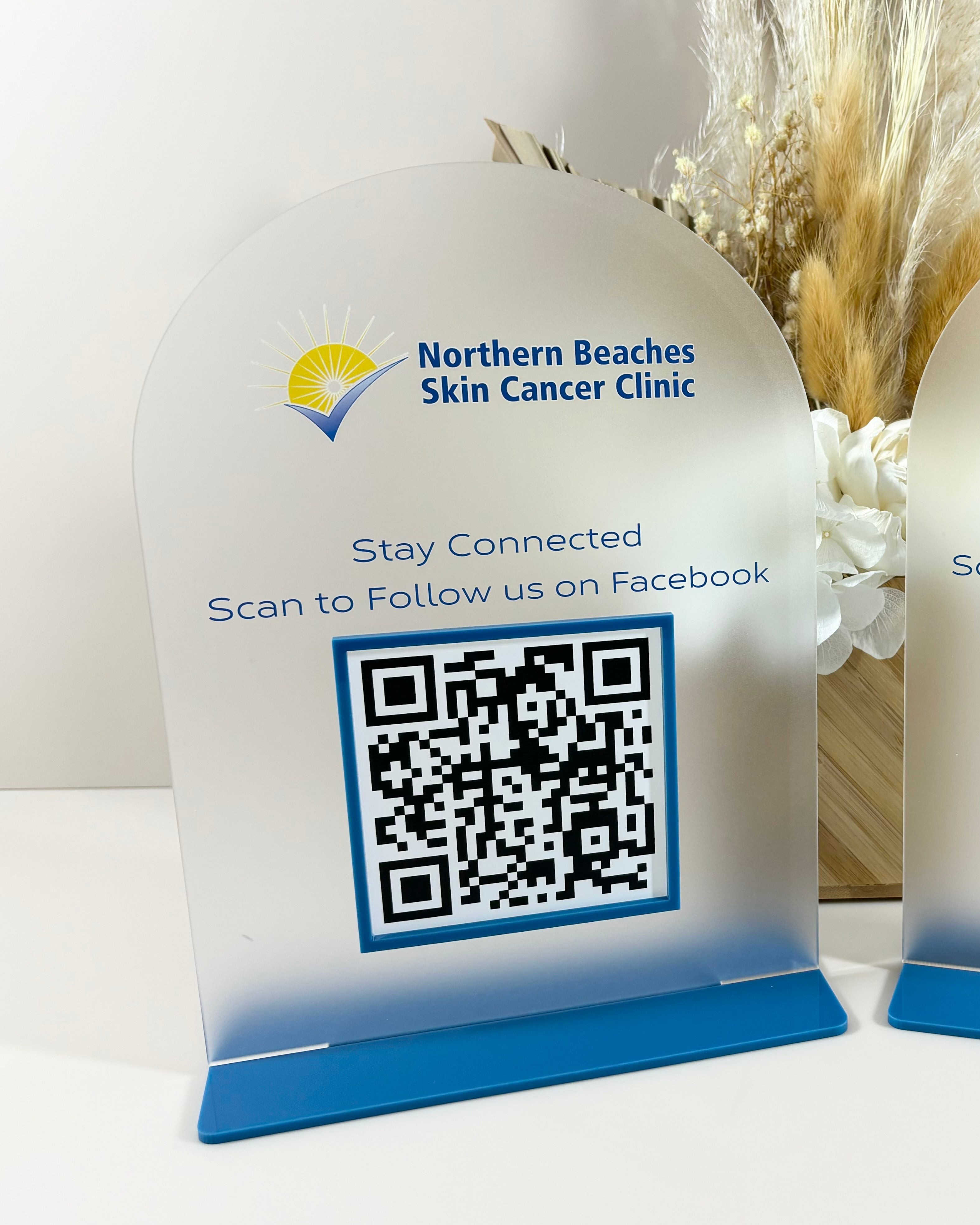 Scan to shop QR code display for skin care clinic counter