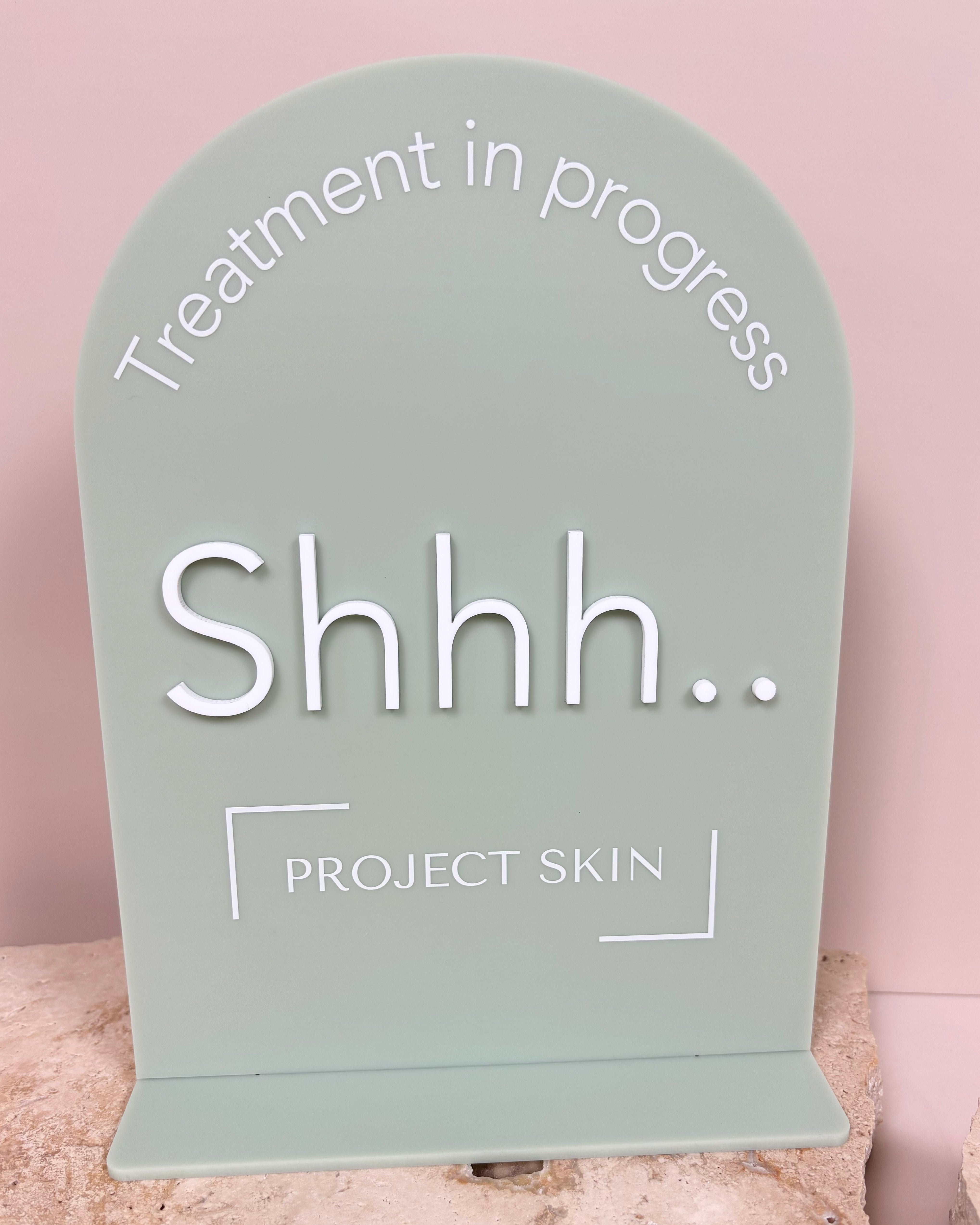 Green shhhh treatment in progress stand with logo