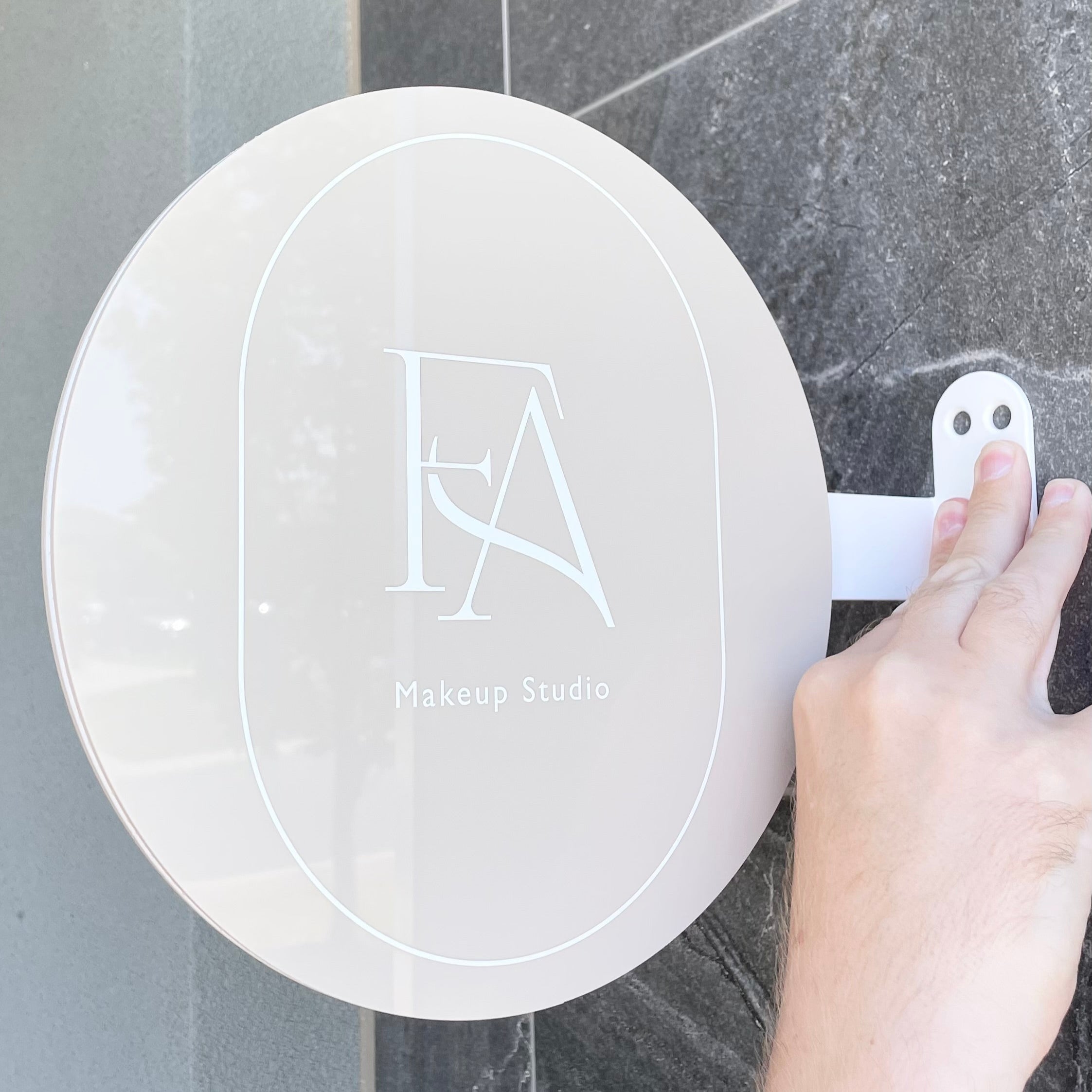 Beige acrylic round blade sign with elegant FA monogram