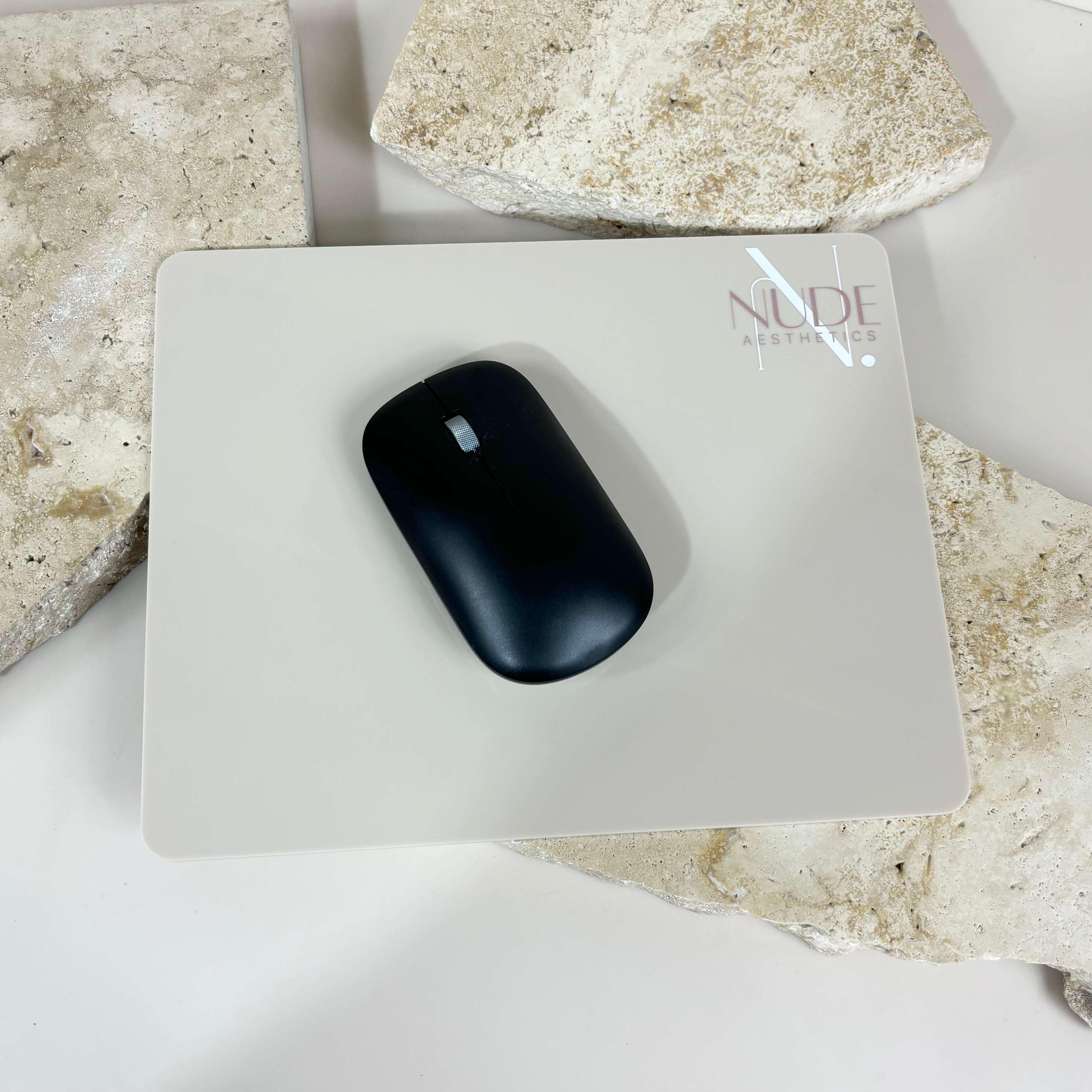 Custom logo mouse pad with black mouse on work surface