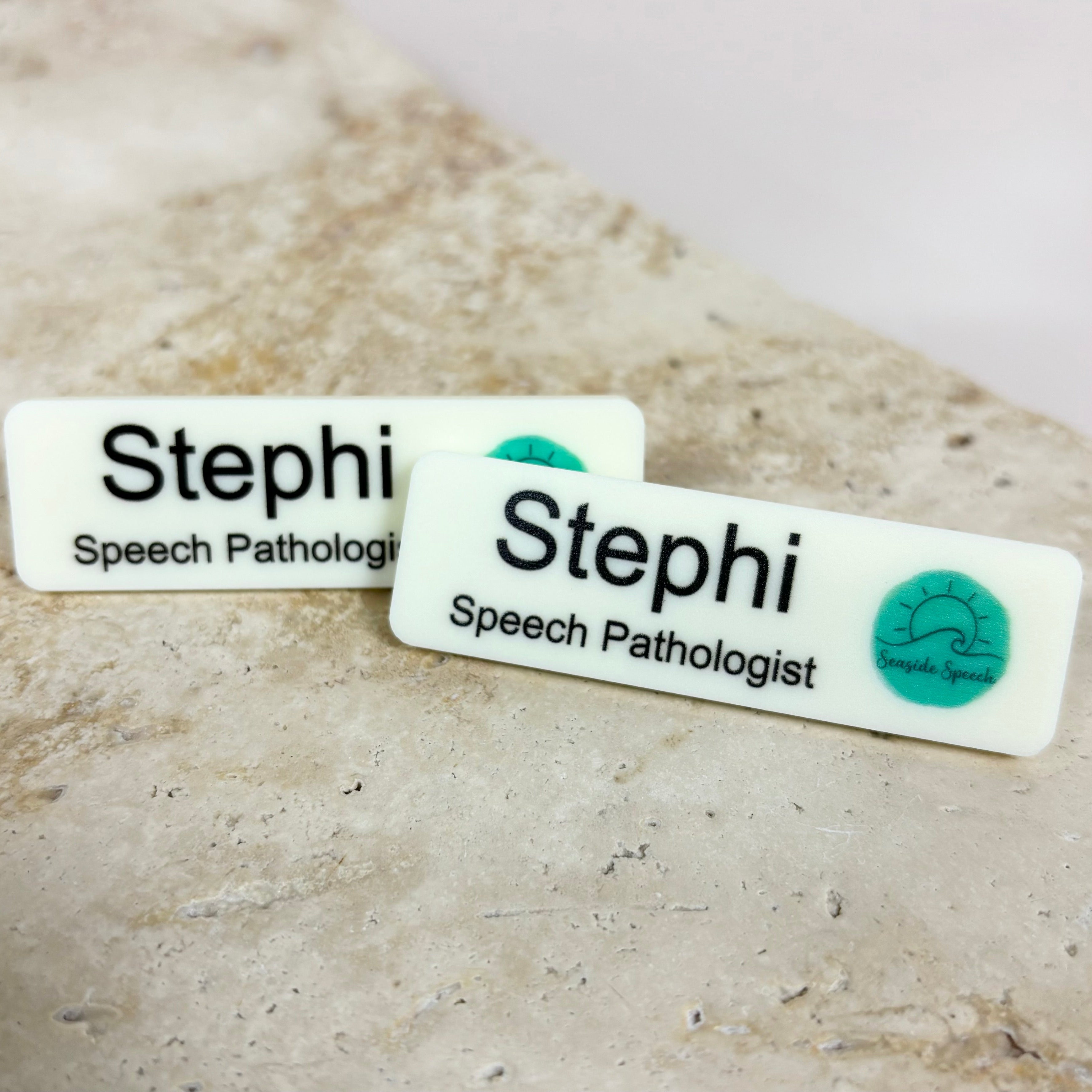 Professional speech pathology name badge with logo