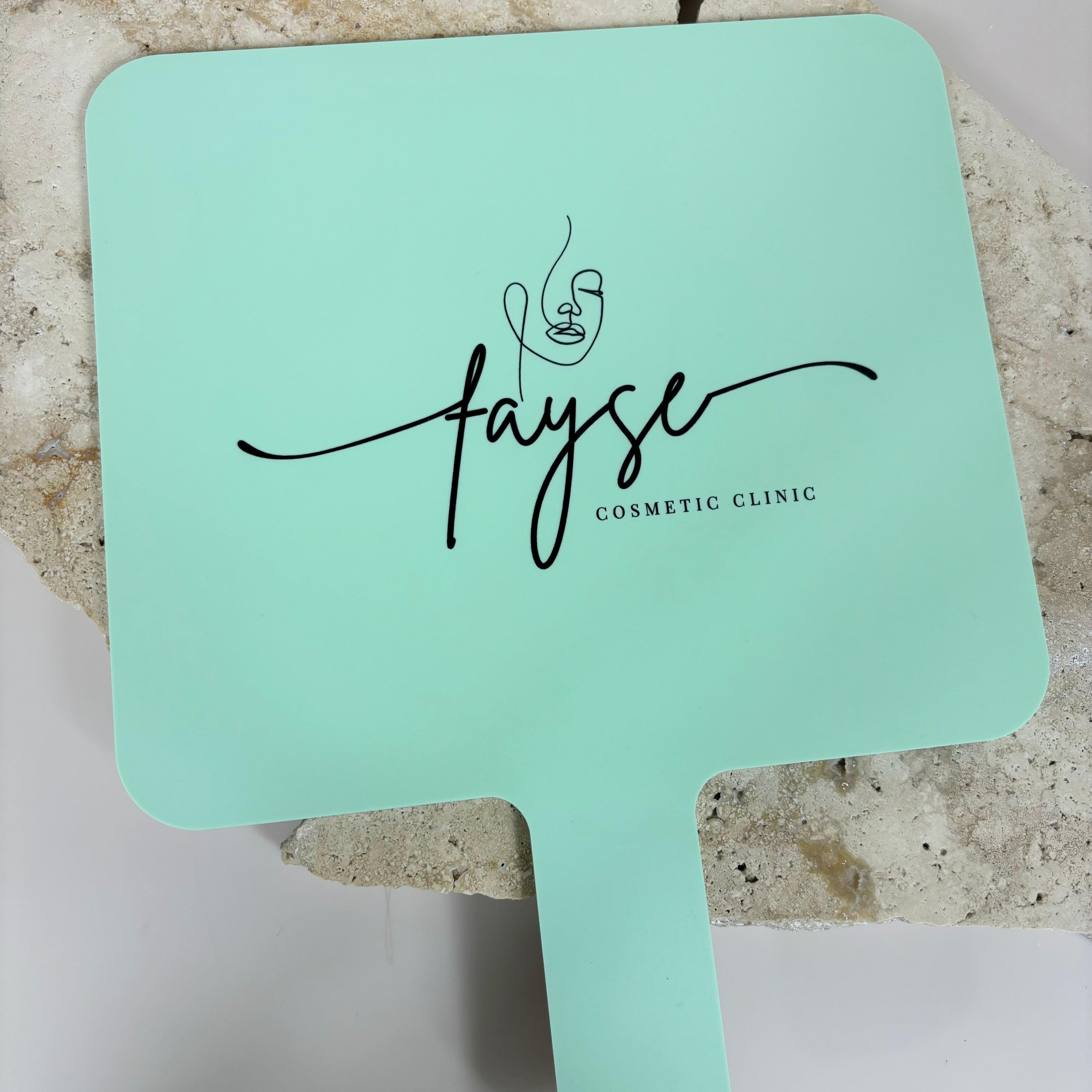 Fayse logo on green custom handheld mirror