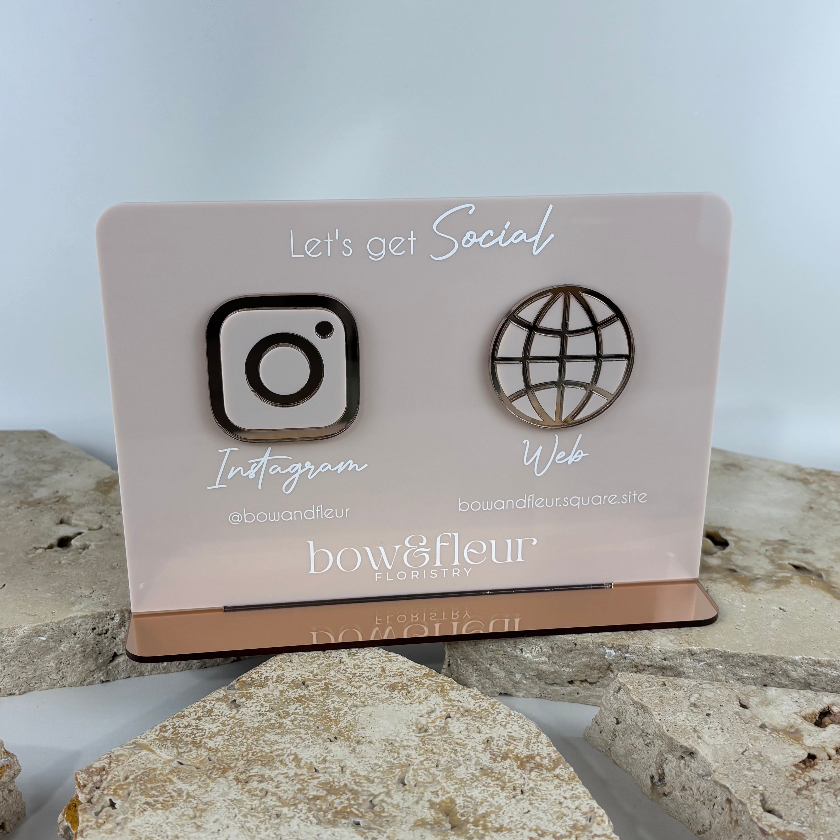 Luxury acrylic social media sign for florist business featuring Instagram and website icons in blush pink acrylic with mirrored bronze base, custom business QR display stand for salon, beauty clinic, florist and small business branding in Australia and New Zealand.