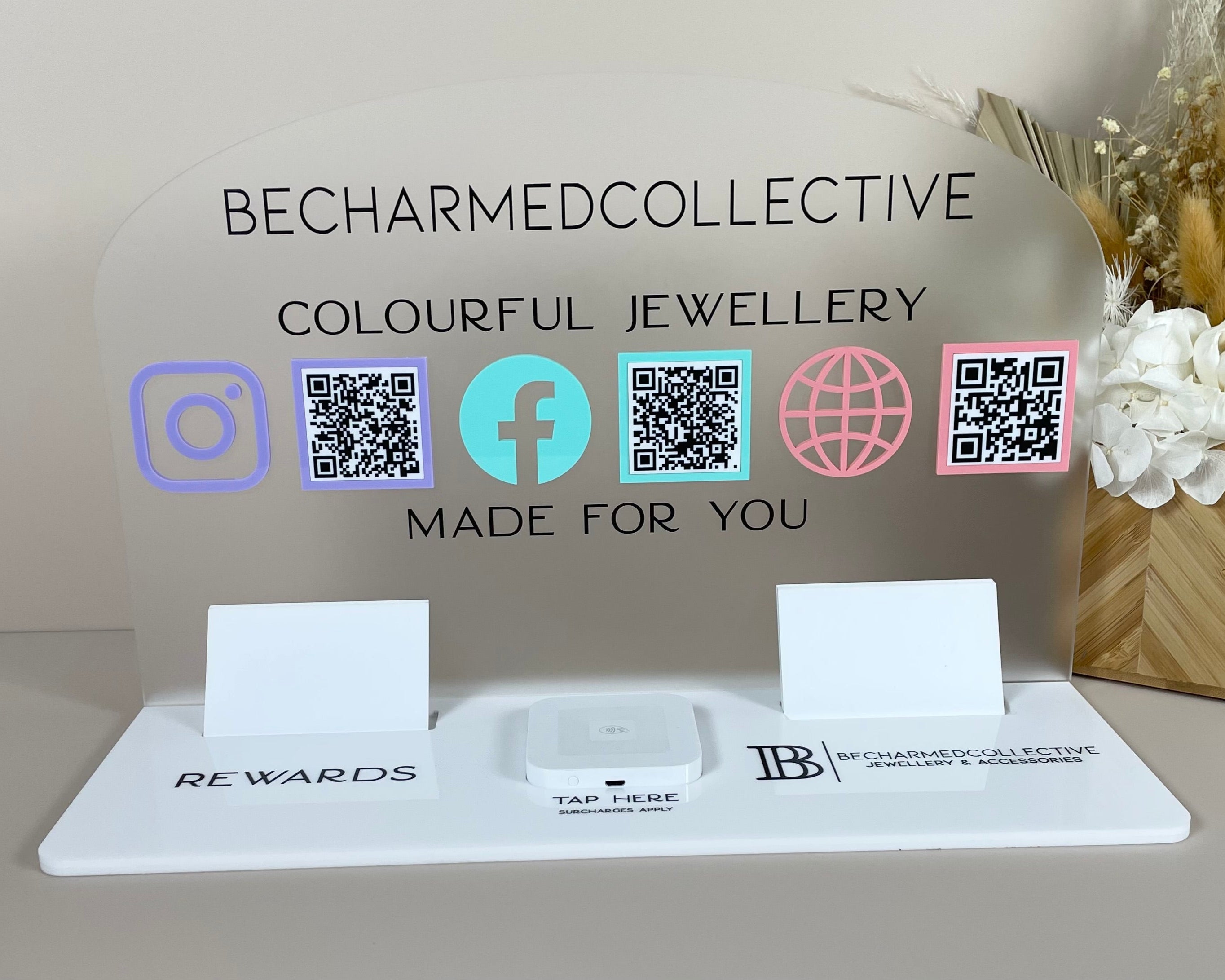 Acrylic marketing display for jewellery brand with QR codes and social icons