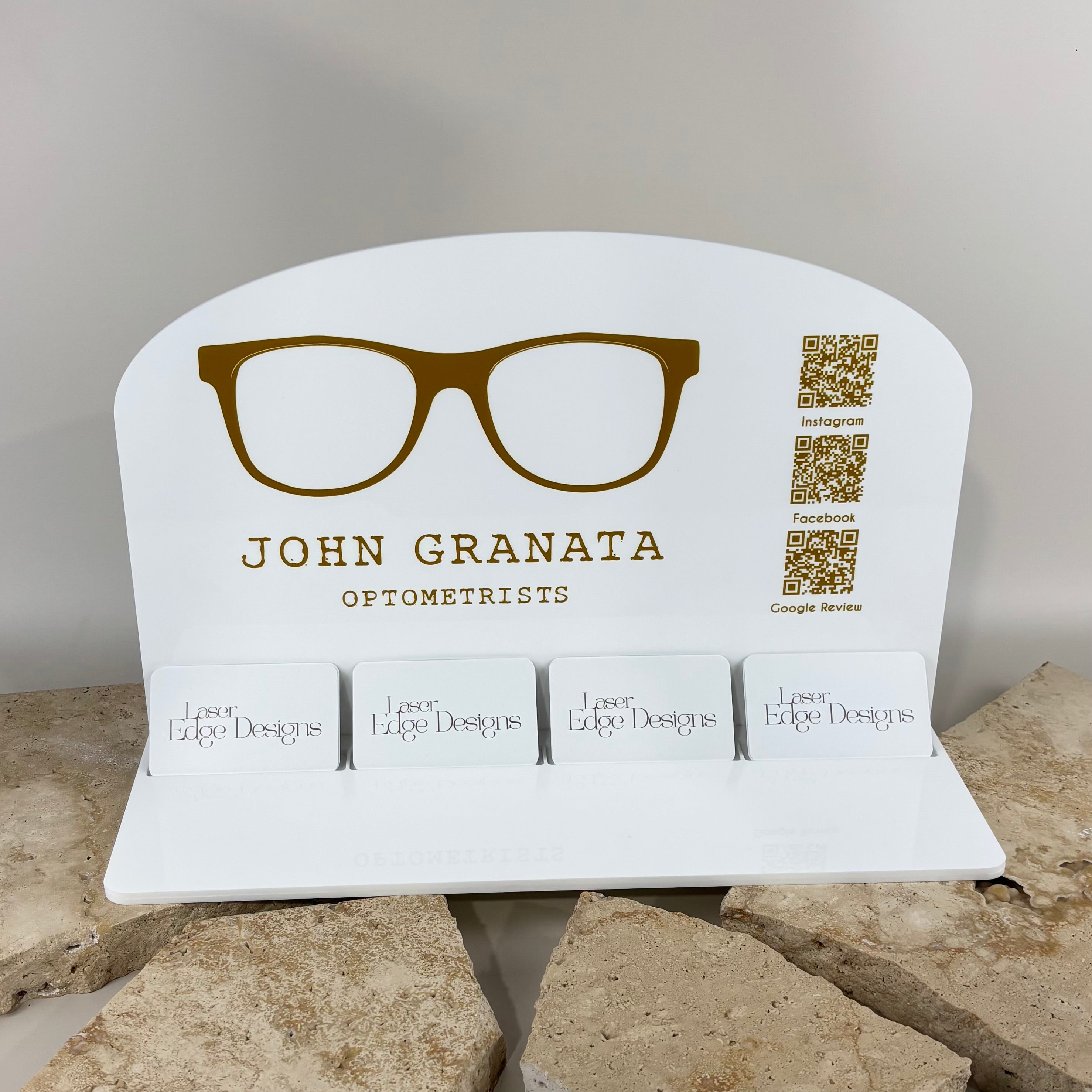 Custom acrylic business card display stand with integrated QR codes for Instagram, Facebook and Google Reviews. Personalised countertop business display for optometrists, retail stores, medical clinics and small businesses featuring multiple business card holders, branded signage and social media marketing.