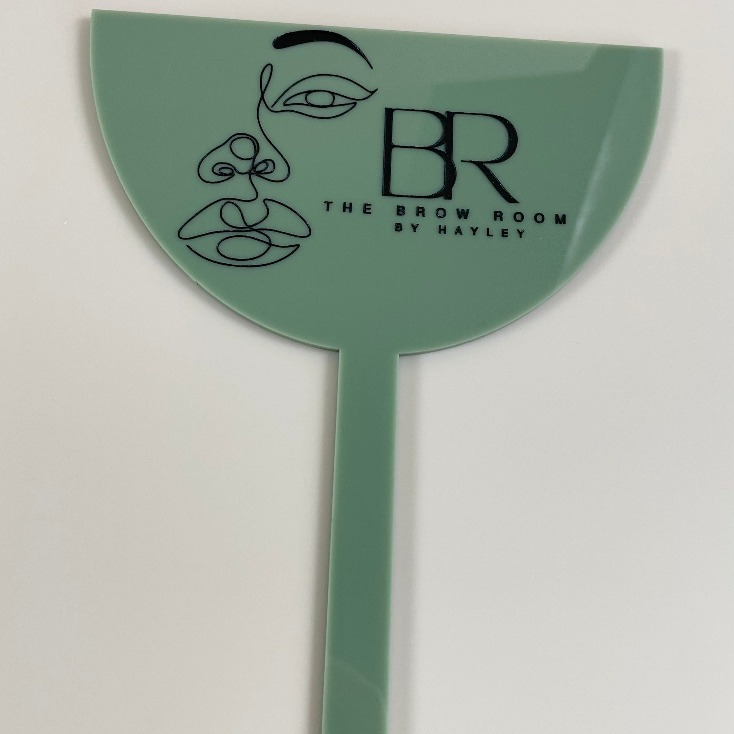 Green branded face shield with BR logo for salons and studios