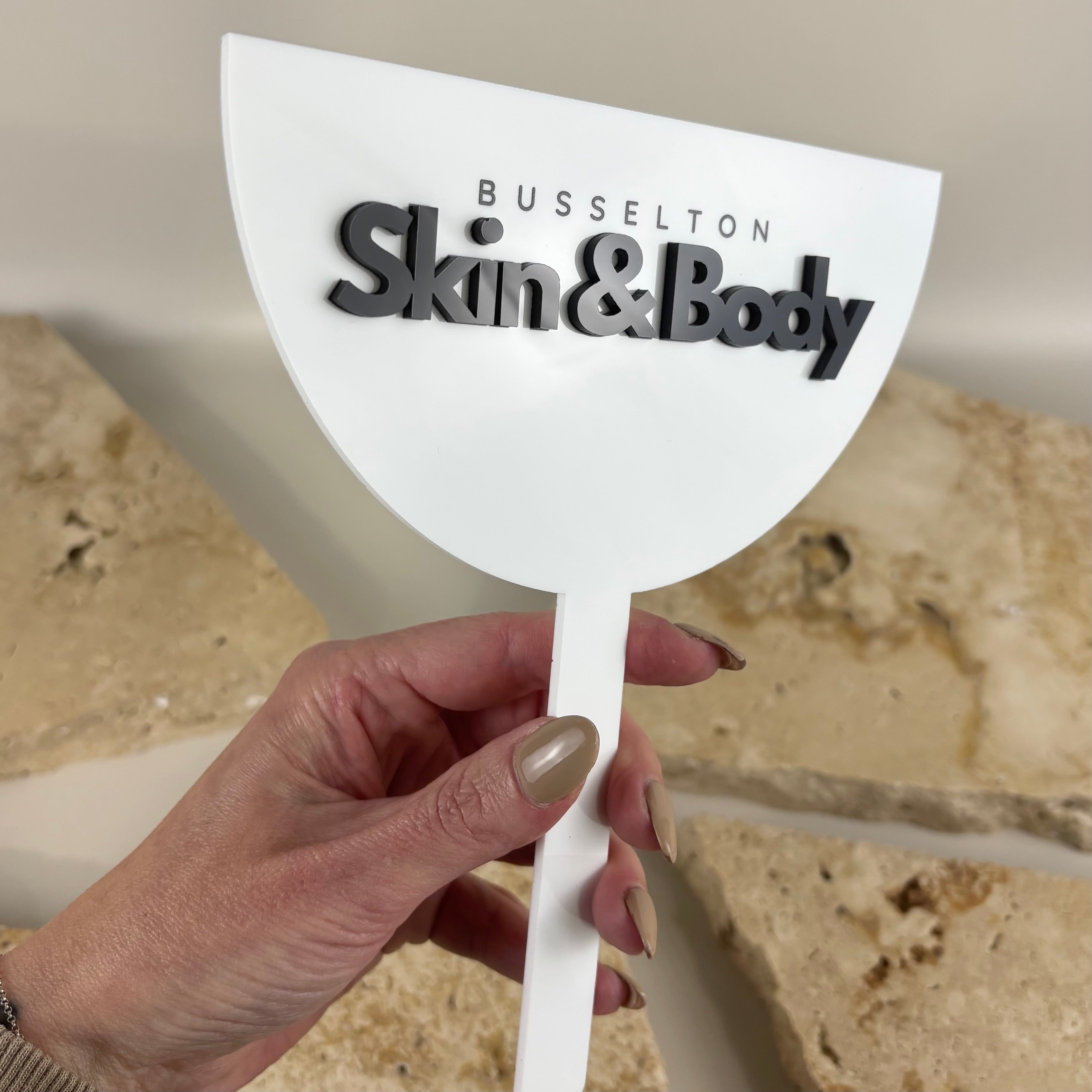 Custom branded acrylic face shield for beauty salons and skin clinics, personalised logo privacy shield for client photos, reusable business branding prop for cosmetic, skincare and aesthetic businesses