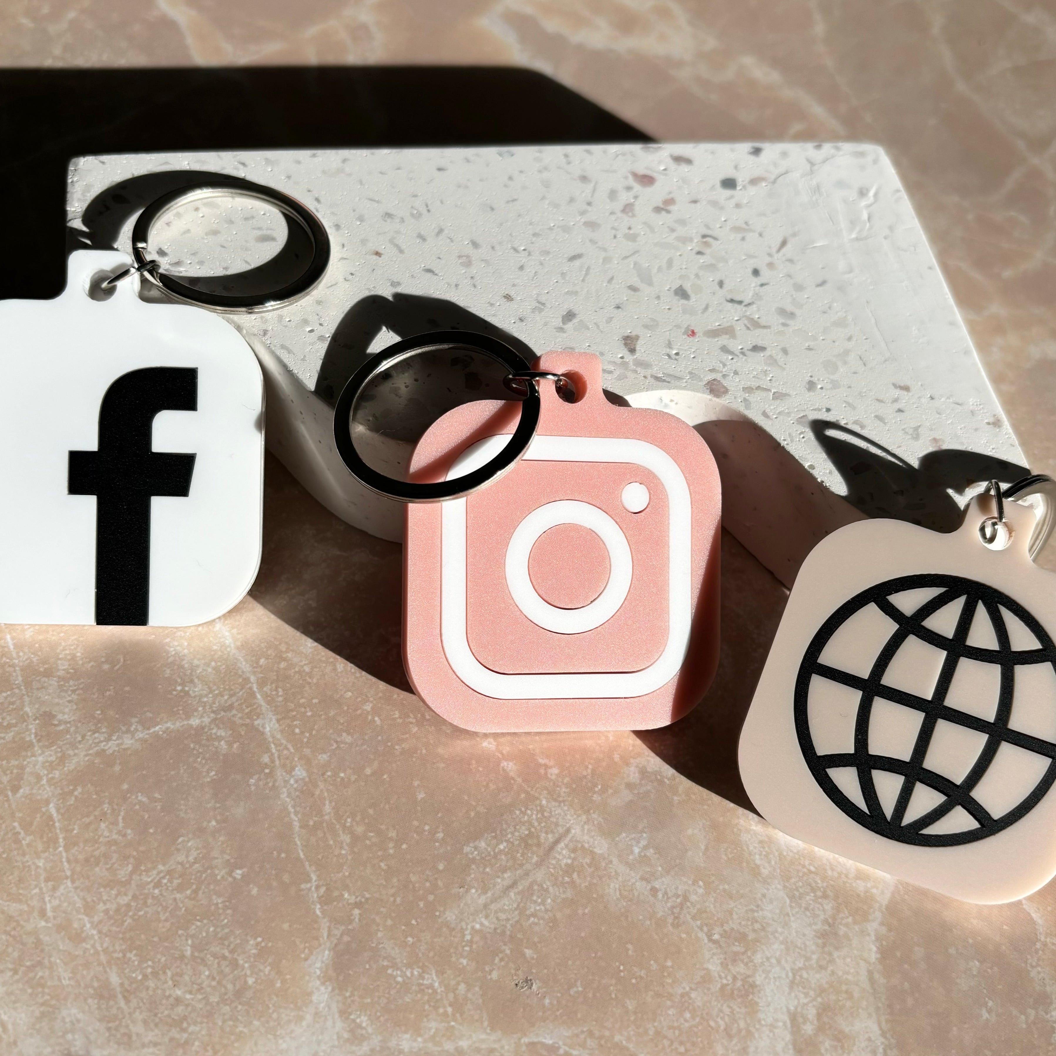 Peach and white NFC business keychains for social media access and branding