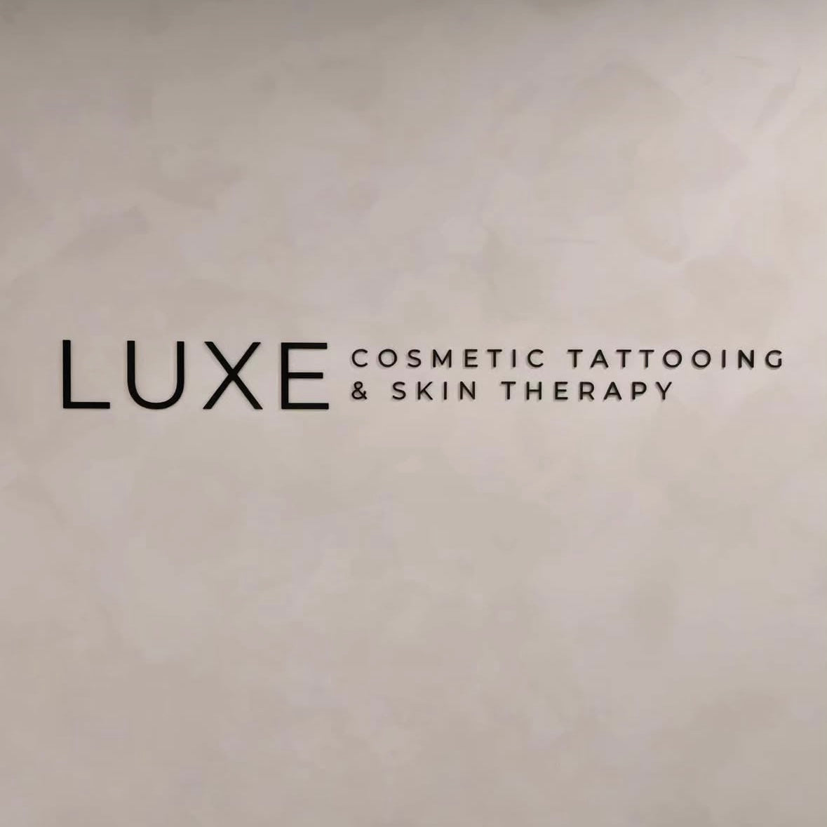 3d acrylic signage on salon feature wall