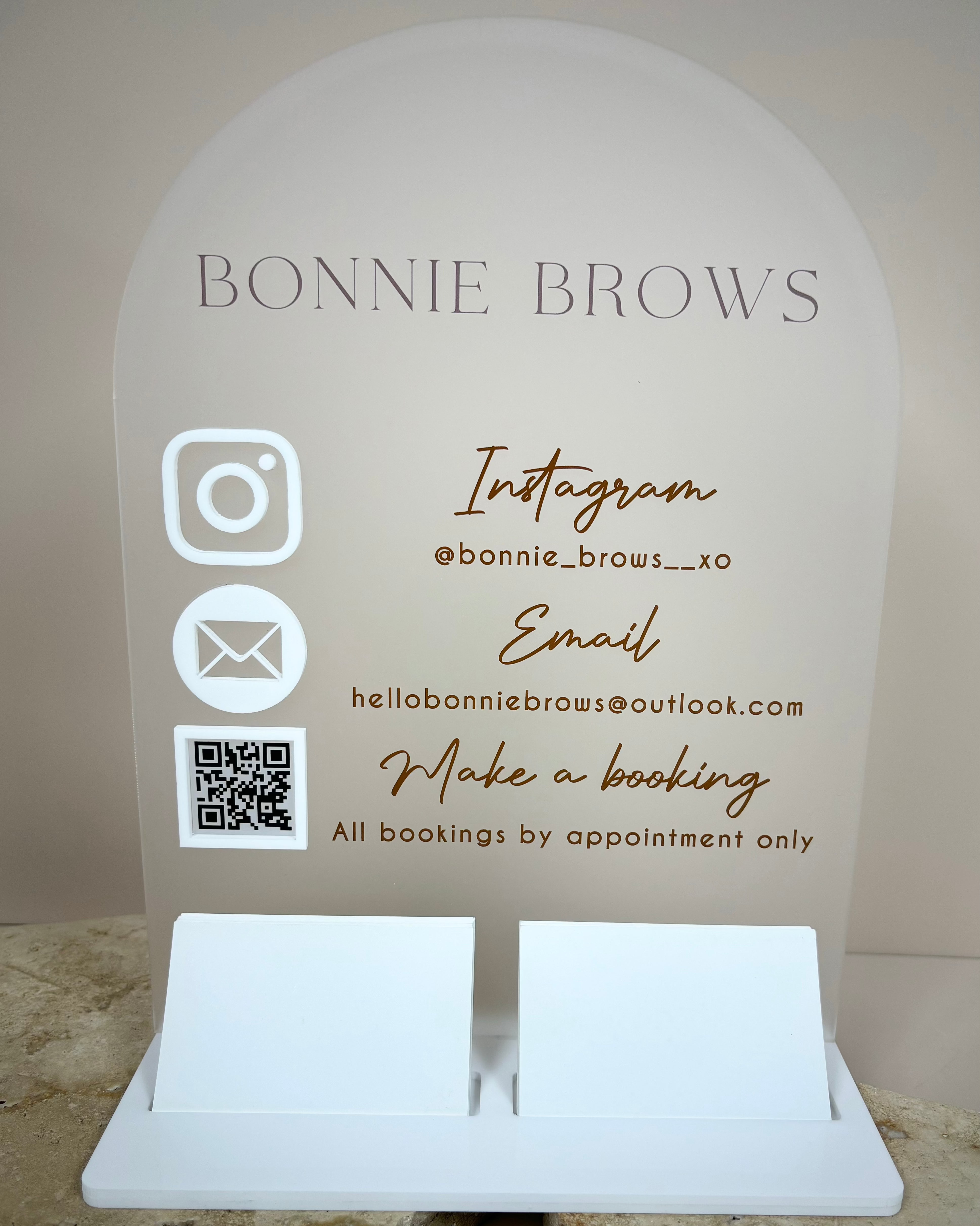 Curved acrylic counter stand for Bonnie Brows with multiple contact icons