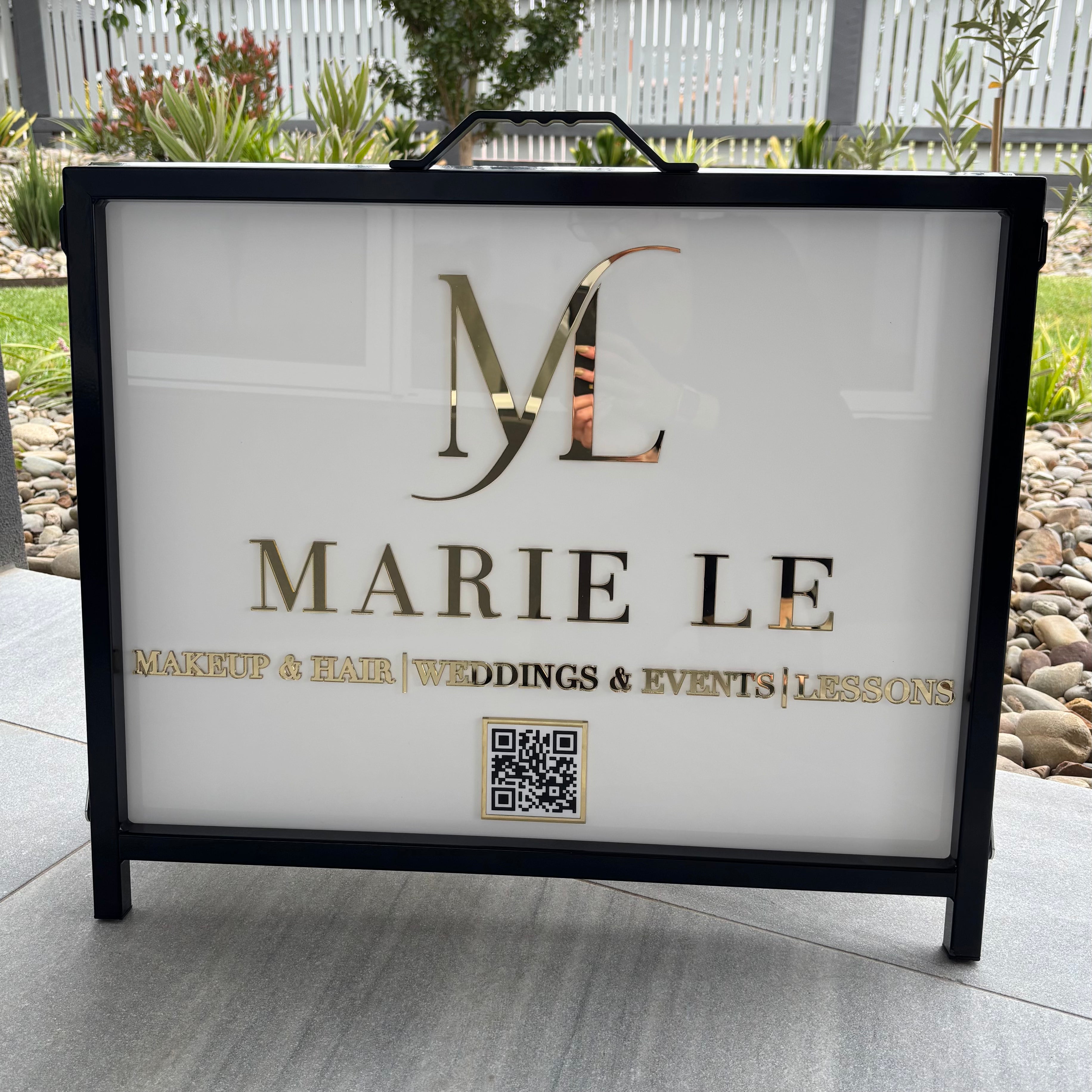 Custom A-frame sign with white acrylic panel and raised gold mirror lettering, personalised business sidewalk sign for salons, makeup artists and beauty studios.
