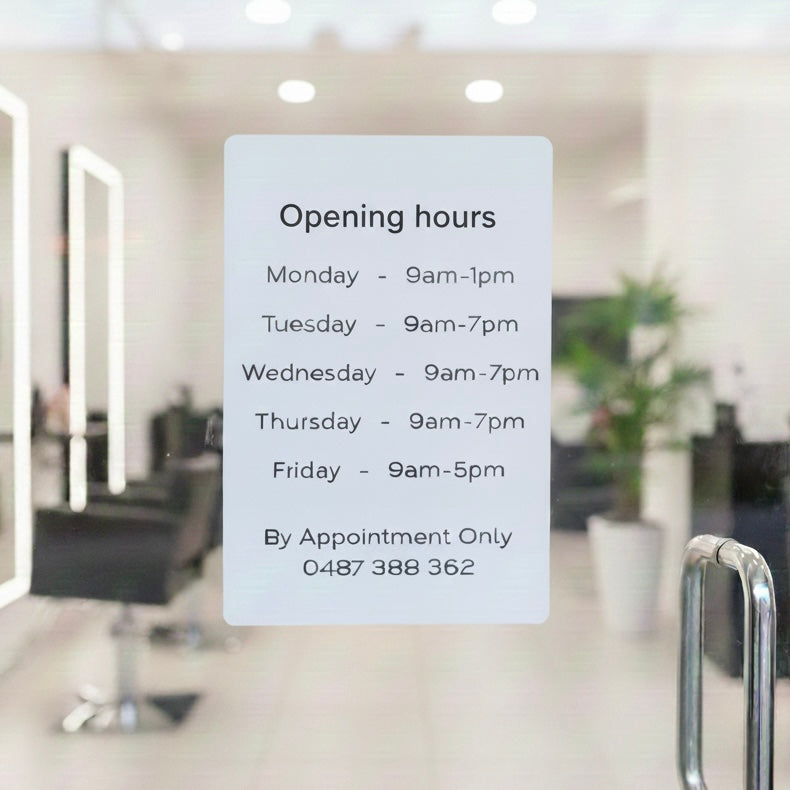 Opening hours acrylic sign mounted on salon glass door using clear suction cups, white acrylic business hours sign with black lettering for beauty salon, removable glass door signage Australia.