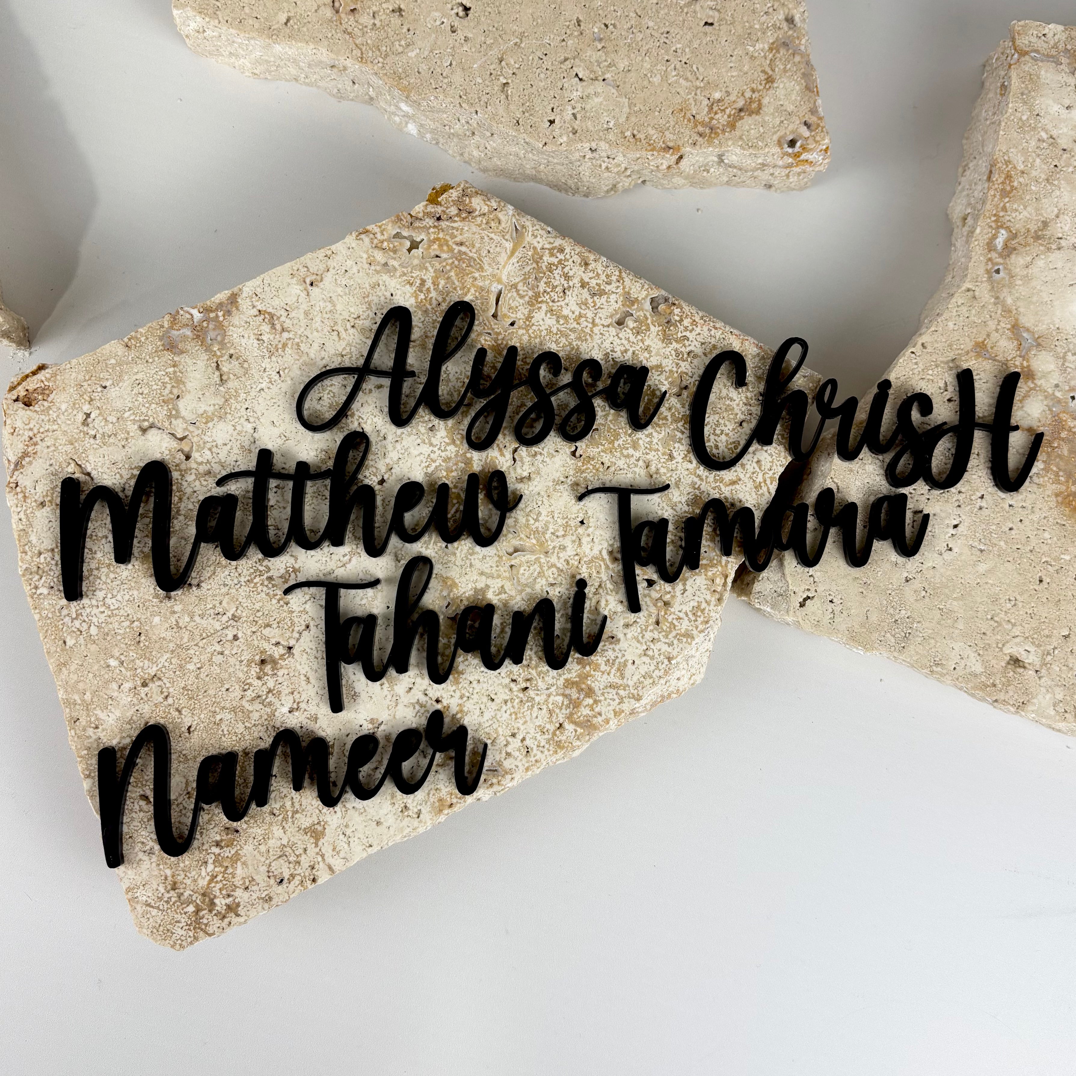Custom black acrylic name cutouts in script font for personalised place cards, events, weddings and parties