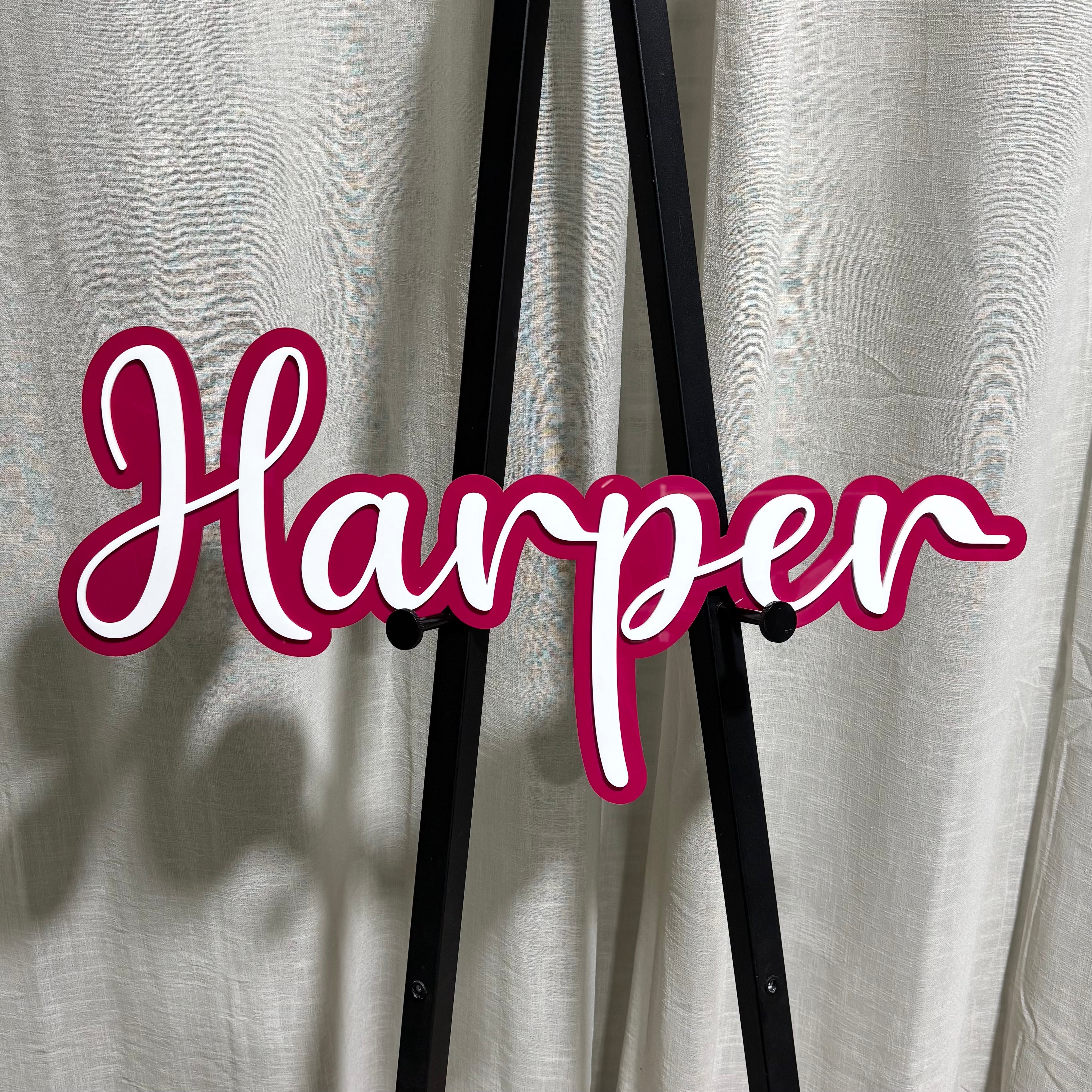 Layered acrylic name plaque with raised script lettering in burgundy and white, custom personalised name sign for business or events, Australian made