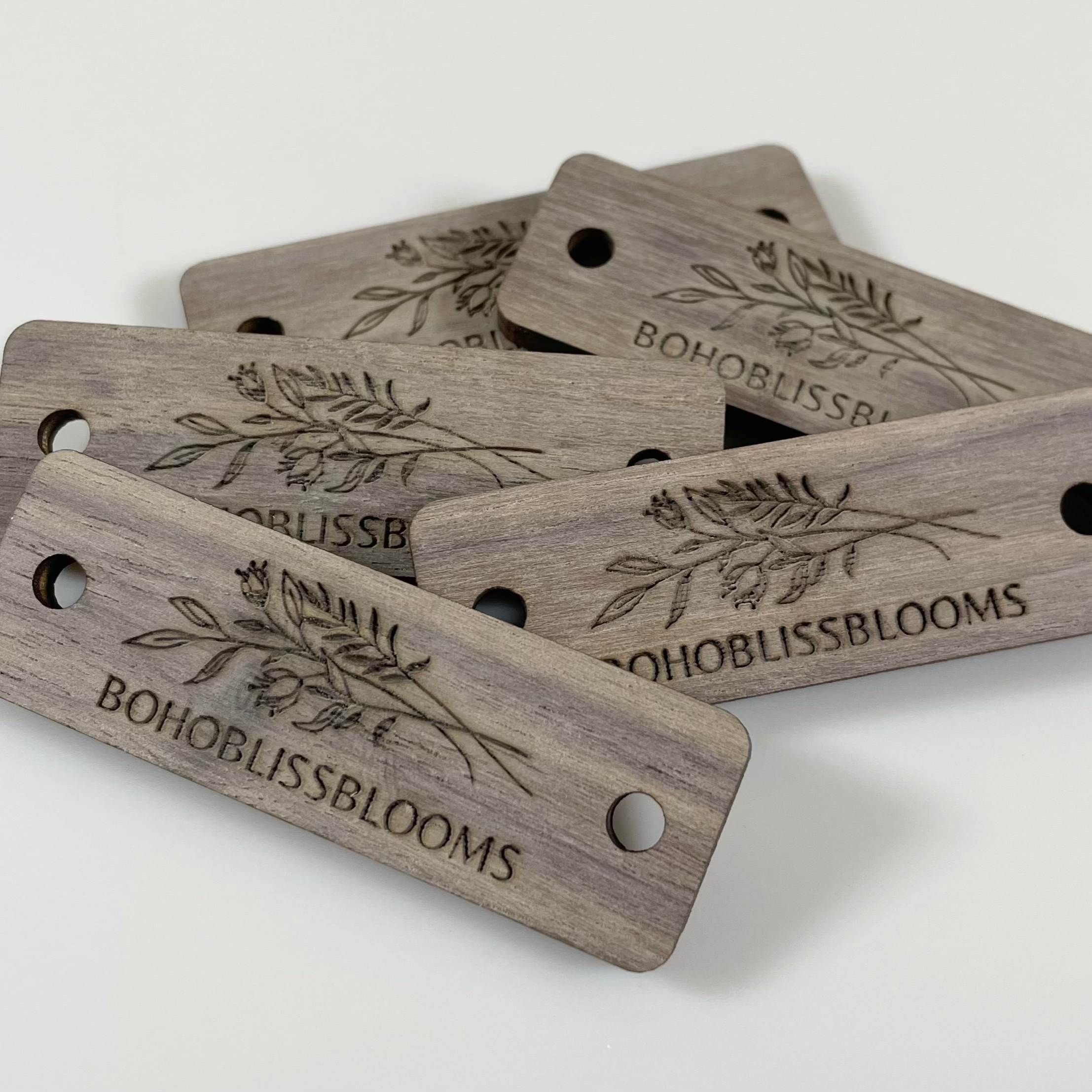 Set of engraved rectangle tags featuring custom logo and leaf design