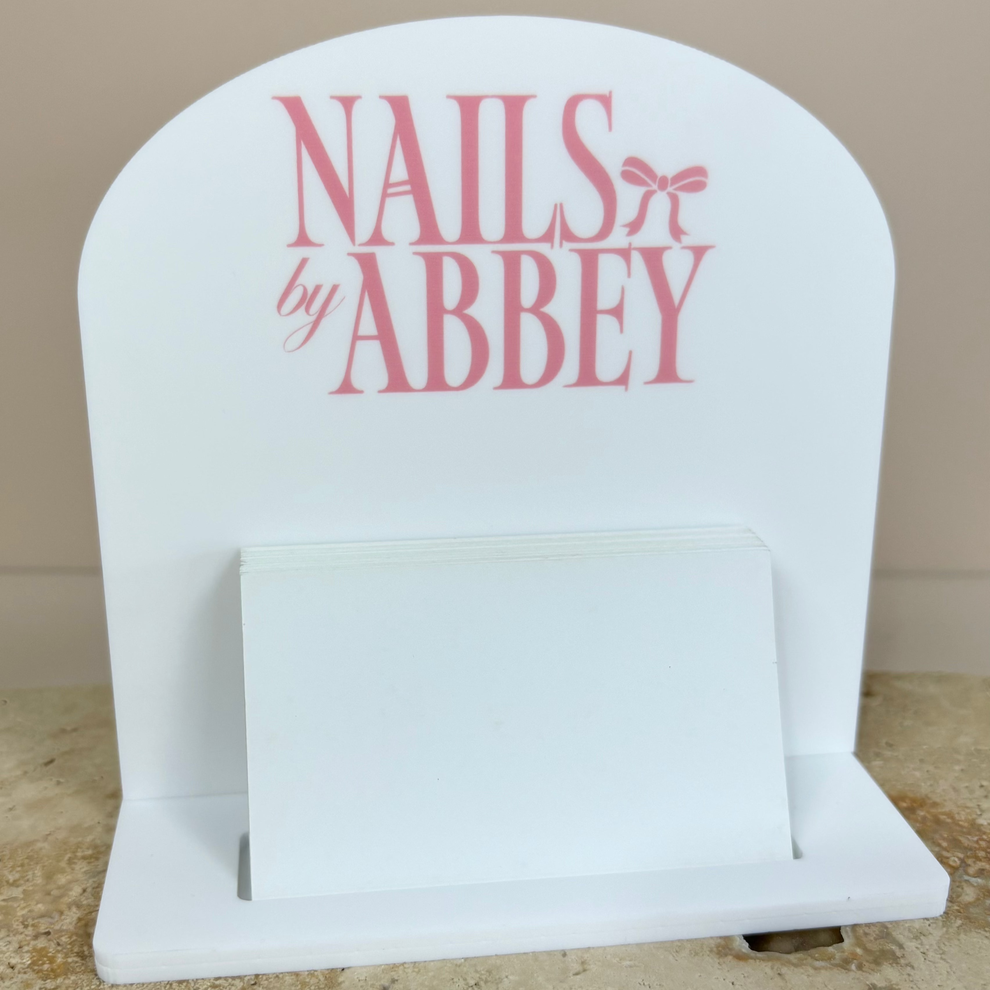 Light pink and white mini card stand for Nails by Abbey salon