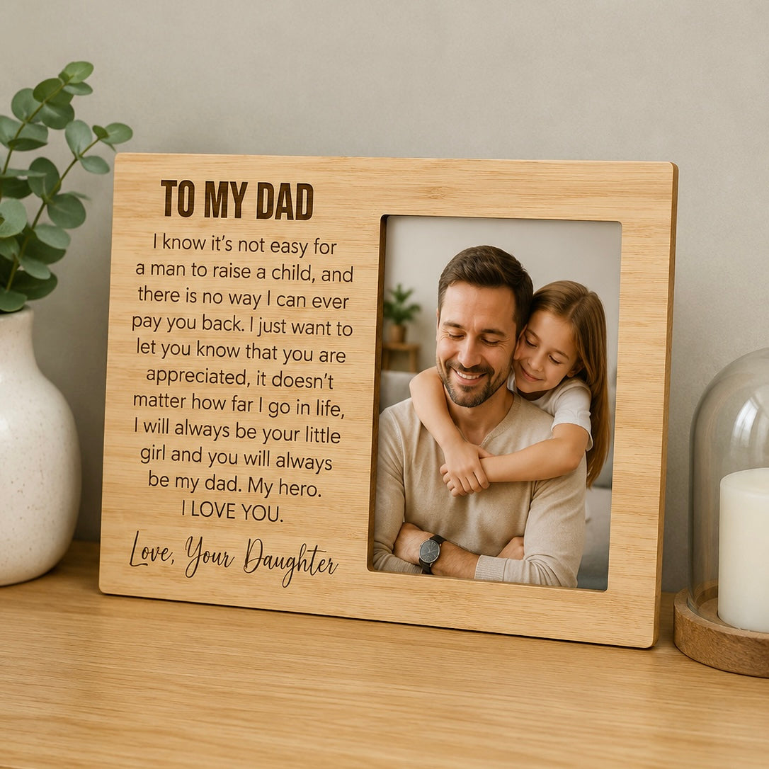 Personalised bamboo “To My Dad” photo frame with engraved heartfelt message from daughter, featuring a 6x4 family photo. A meaningful Father’s Day gift and keepsake displayed on a wooden shelf with neutral home décor.