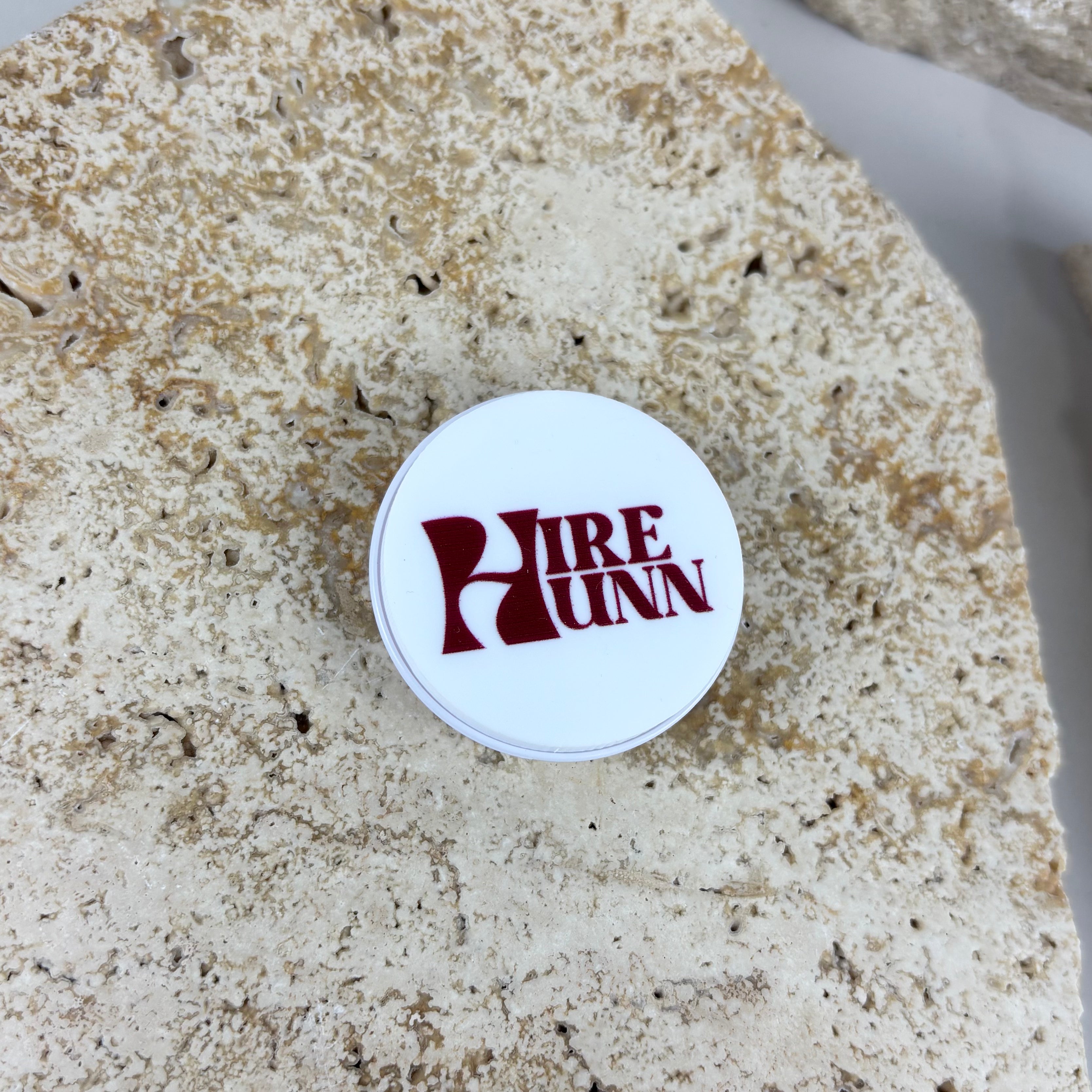 Custom acrylic phone grip with branded logo for small businesses, salons and boutique brands. Personalised round phone holder accessory with UV printed business logo for promotional branding, staff gifts, client giveaways and business merchandise in Australia.