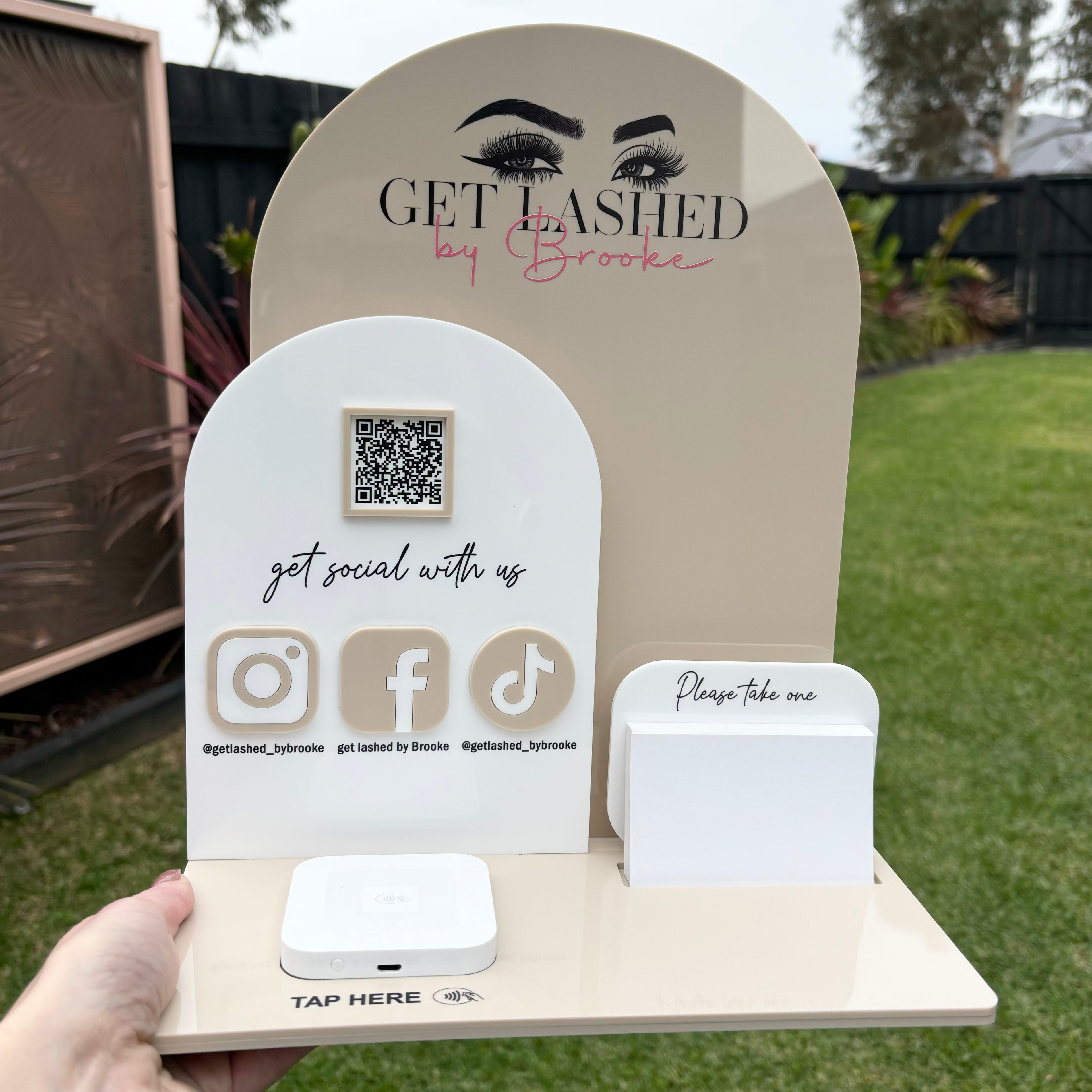 White custom counter stand with Instagram Facebook and QR code display
