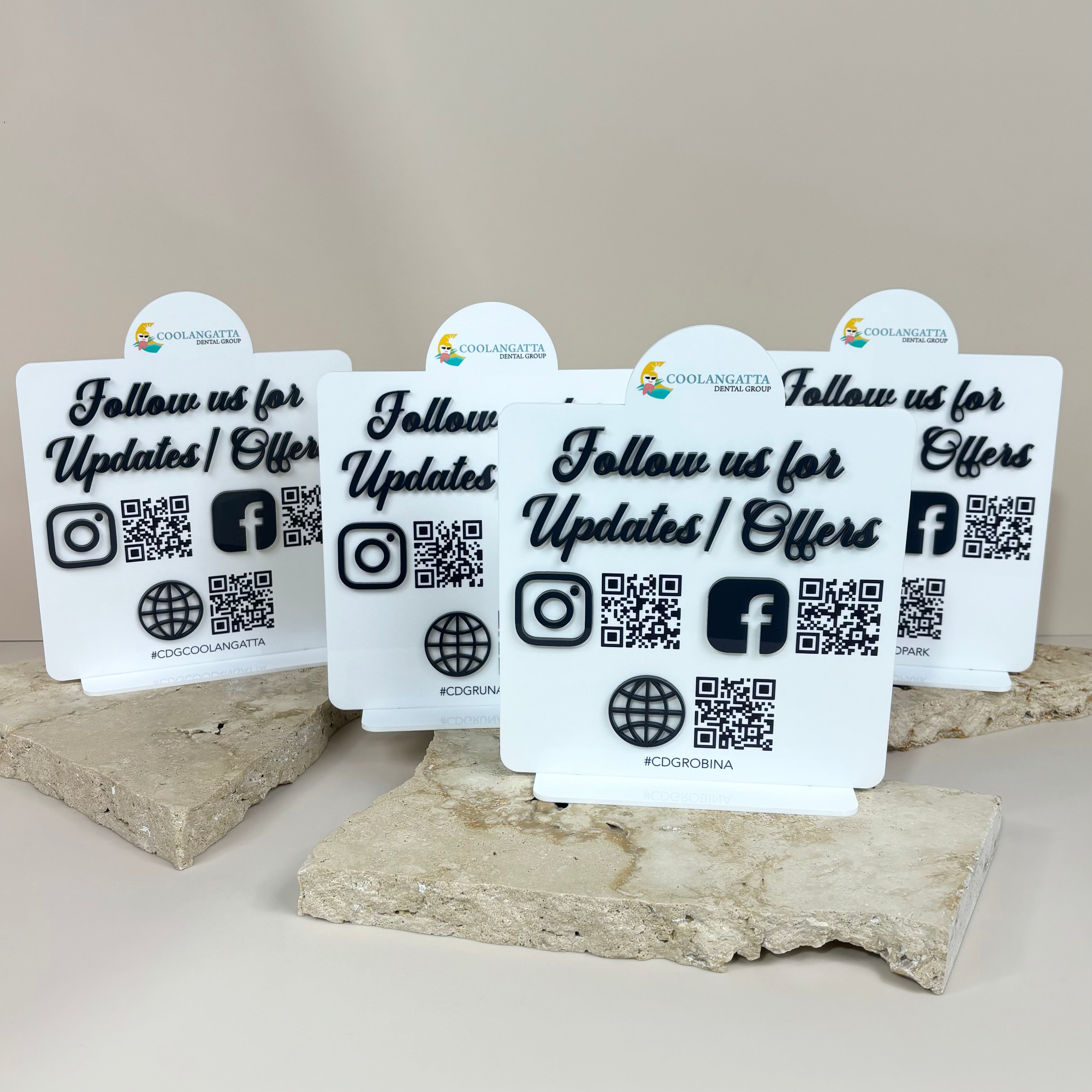 Bulk branded QR code stands with icons for Instagram, Facebook, and website links