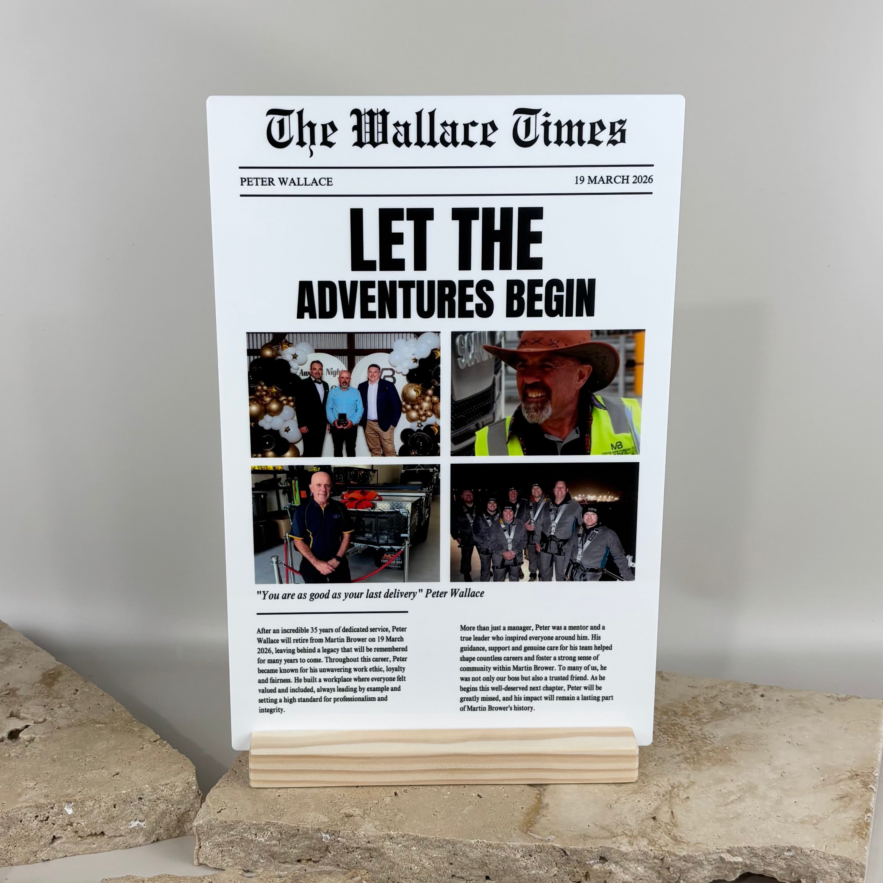 Custom newspaper style photo plaque with printed headline and photos, personalised acrylic keepsake display designed as a retirement gift or milestone celebration plaque with wooden stand.