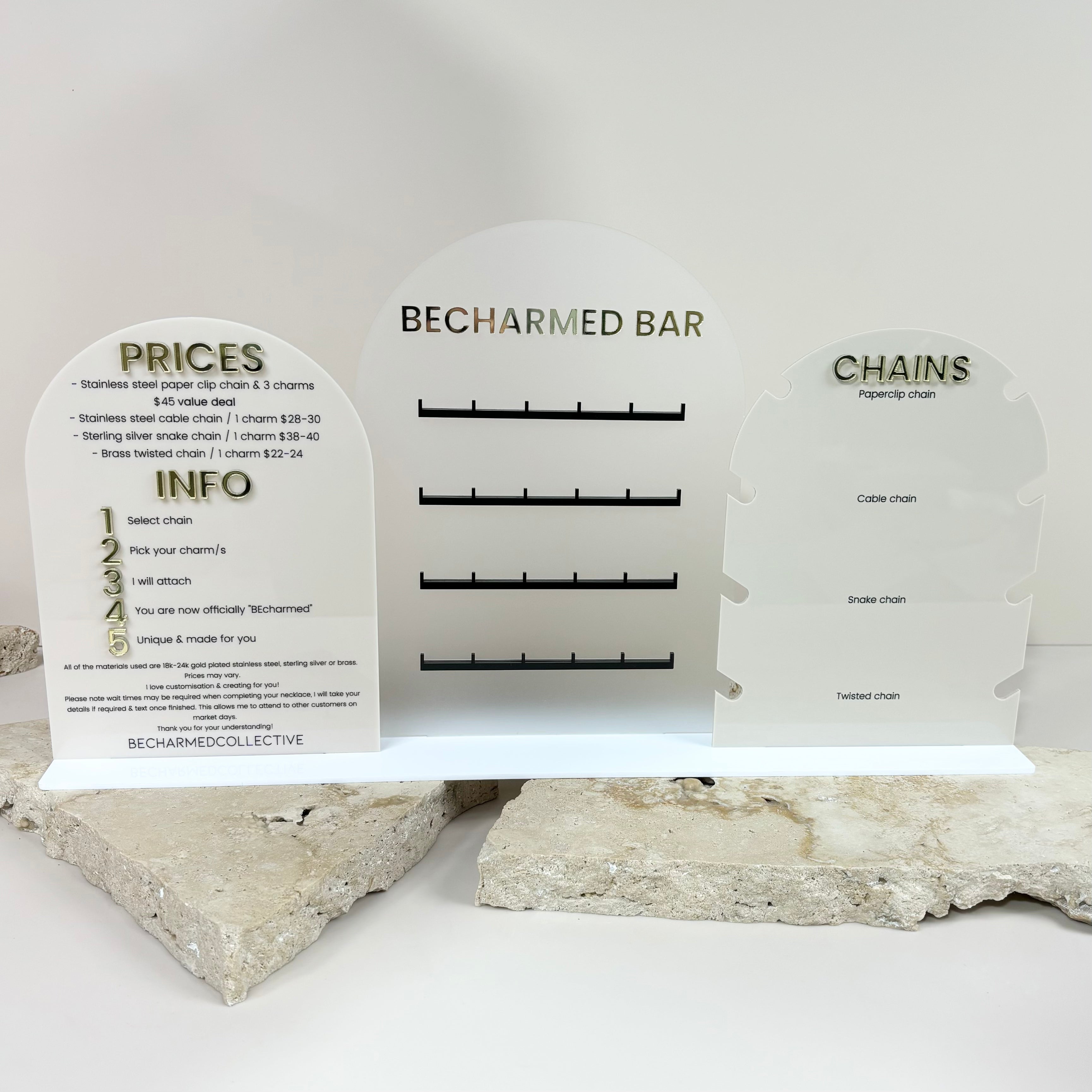 Acrylic charm bar display stand with hooks, pricing, and info section for market stalls
