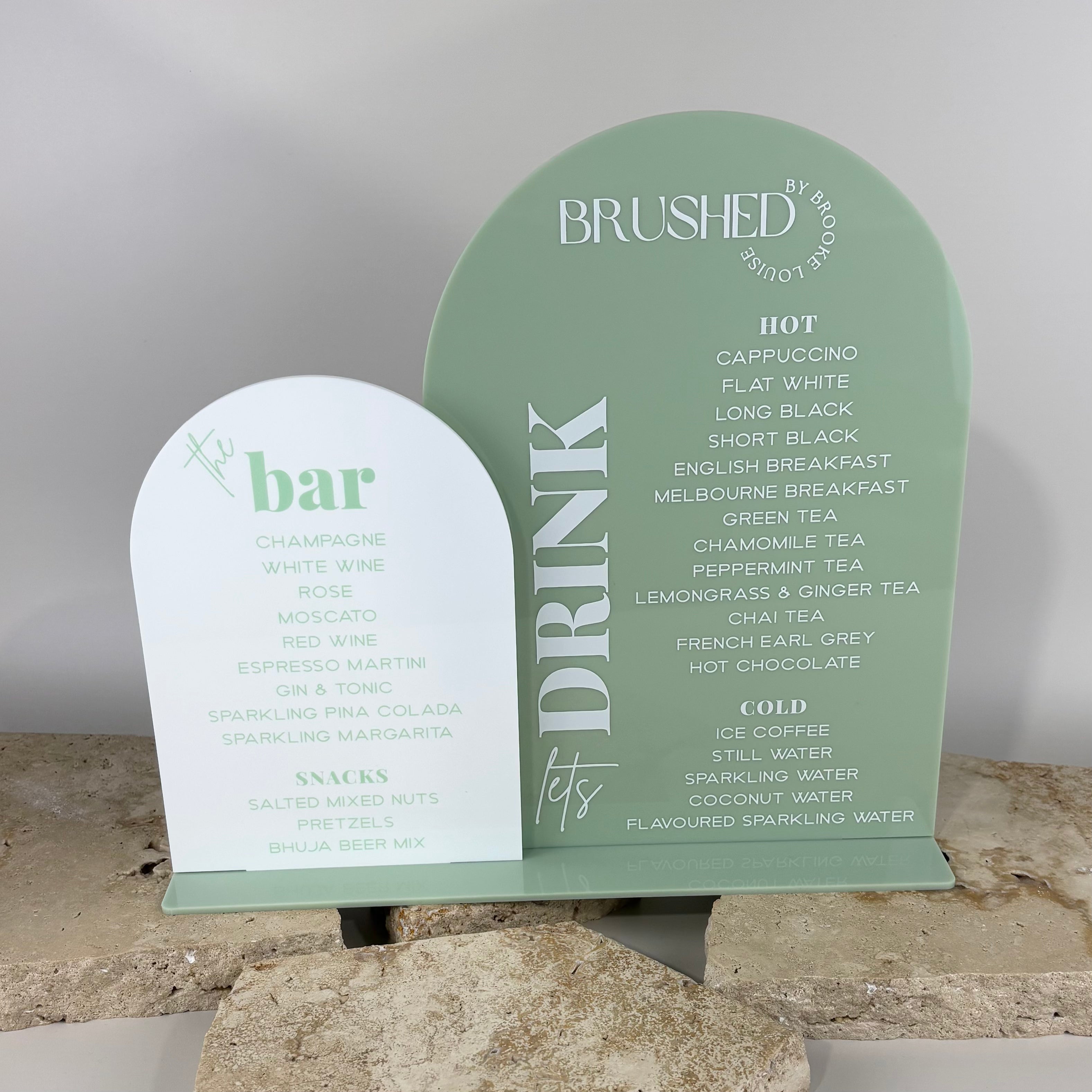 Custom acrylic drink menu sign with raised white text on sage green base for café counter