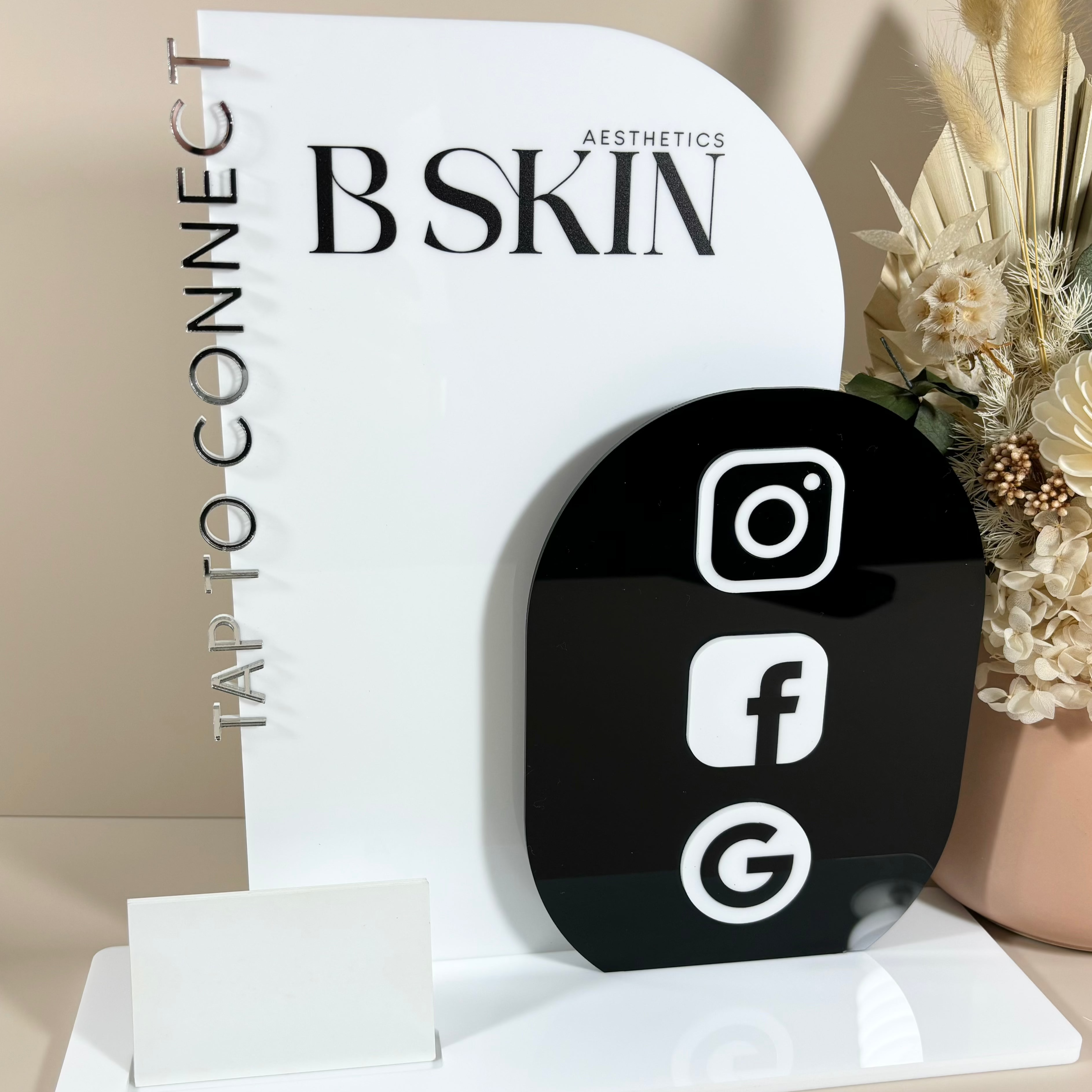 Custom black NFC contactless station for BSKIN with Instagram, Facebook, and Google