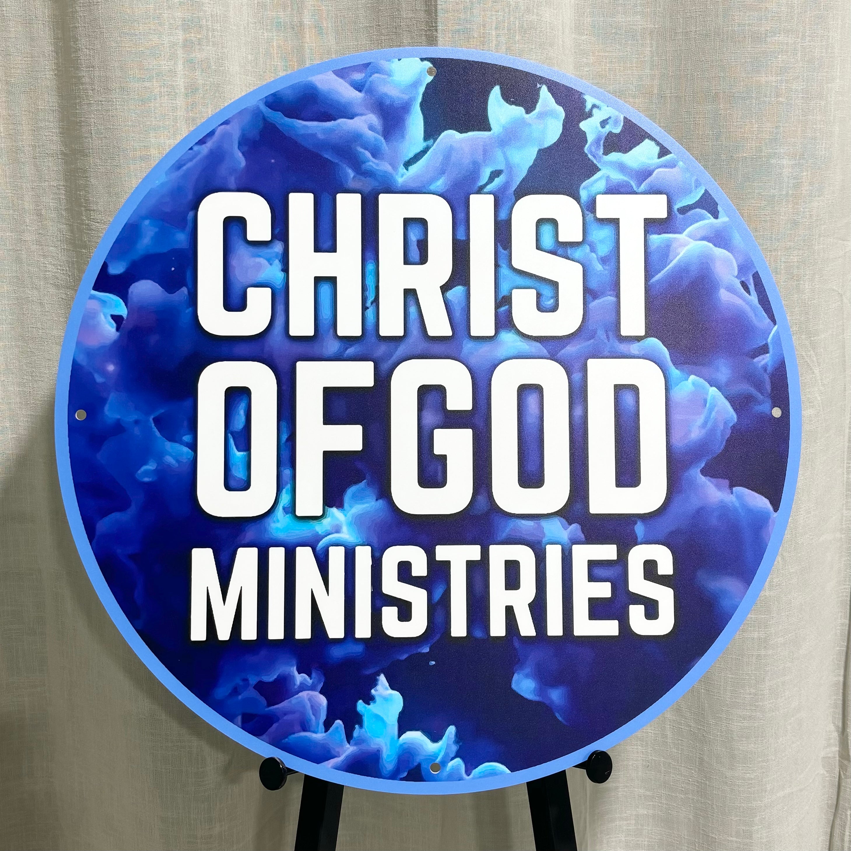 Bold blue religious sign for Christ of God Ministries