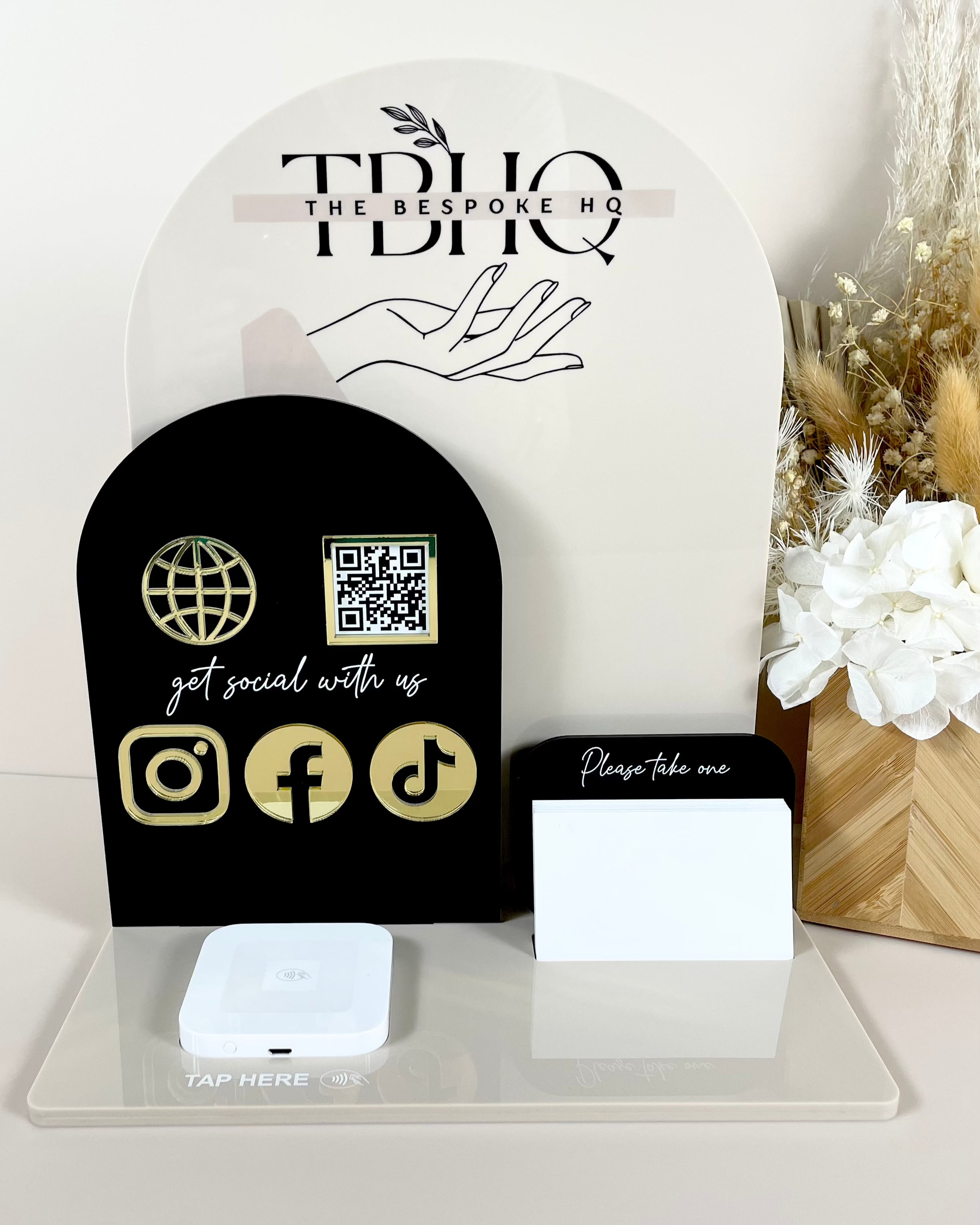 Black and gold business station stand with social media icons and card holder