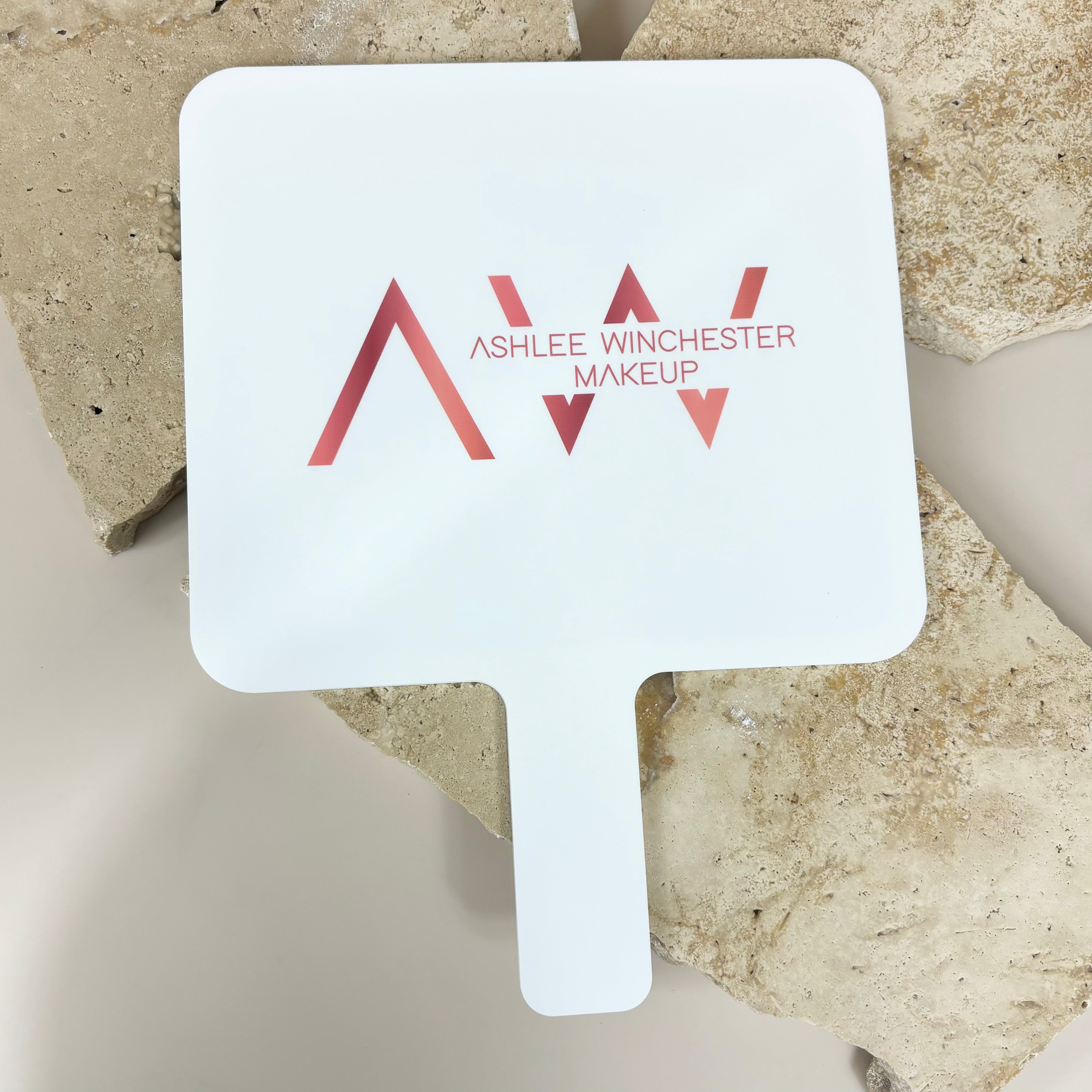 AW logo on personalised handheld mirror for salons