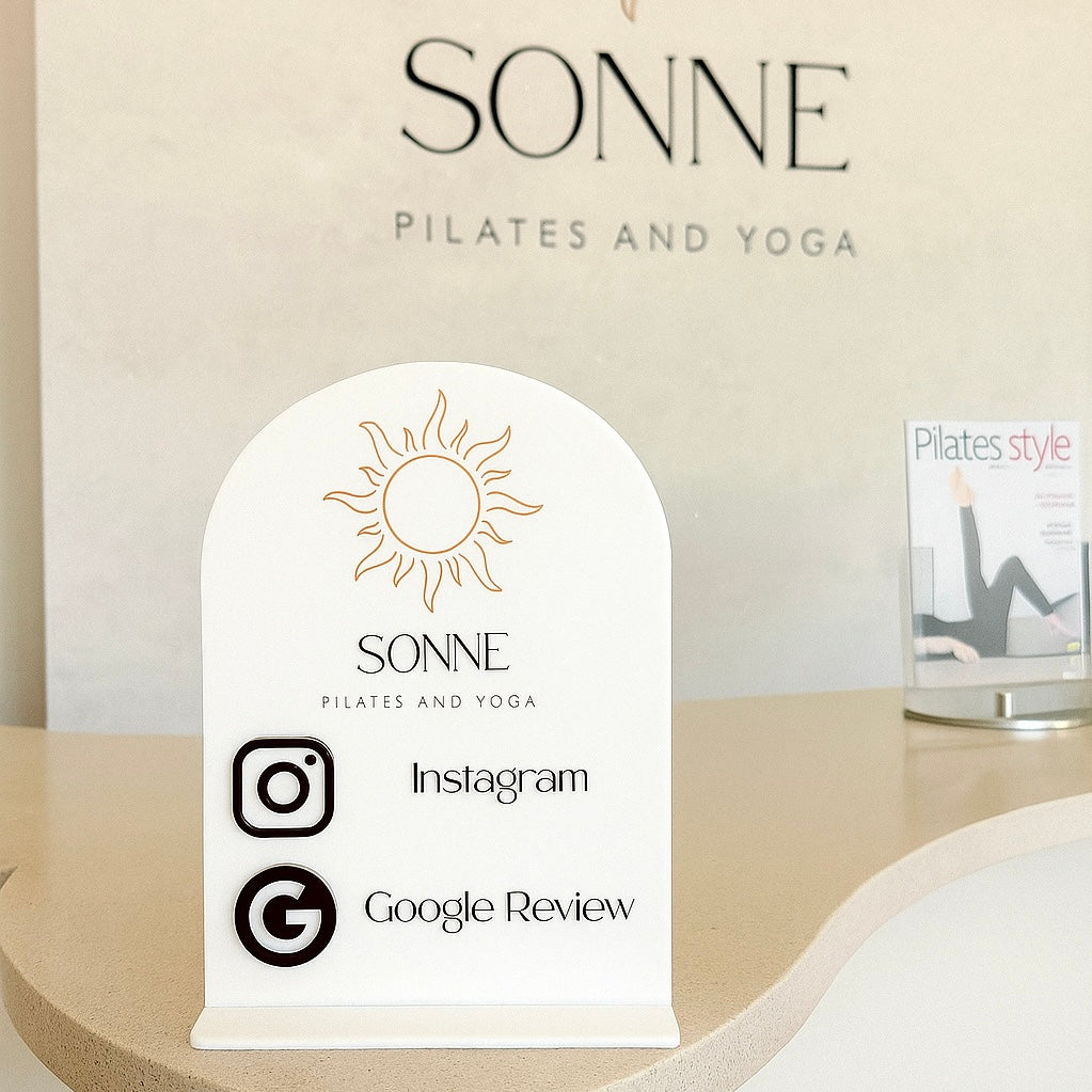 Custom NFC social touch sign for Pilates studio – tap to connect to Instagram and Google Reviews