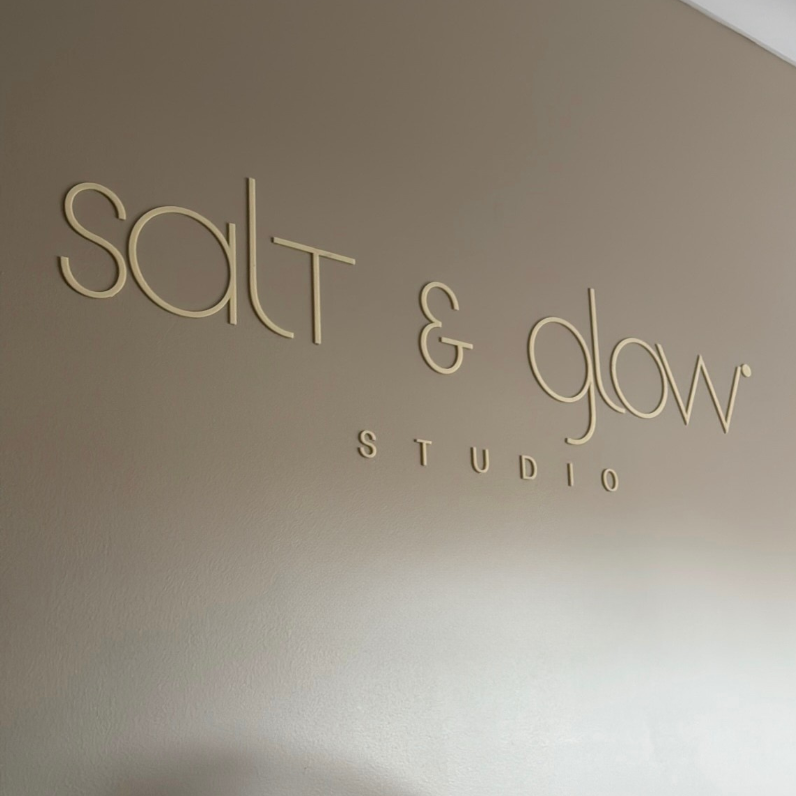 3d acrylic signage on salon feature wall