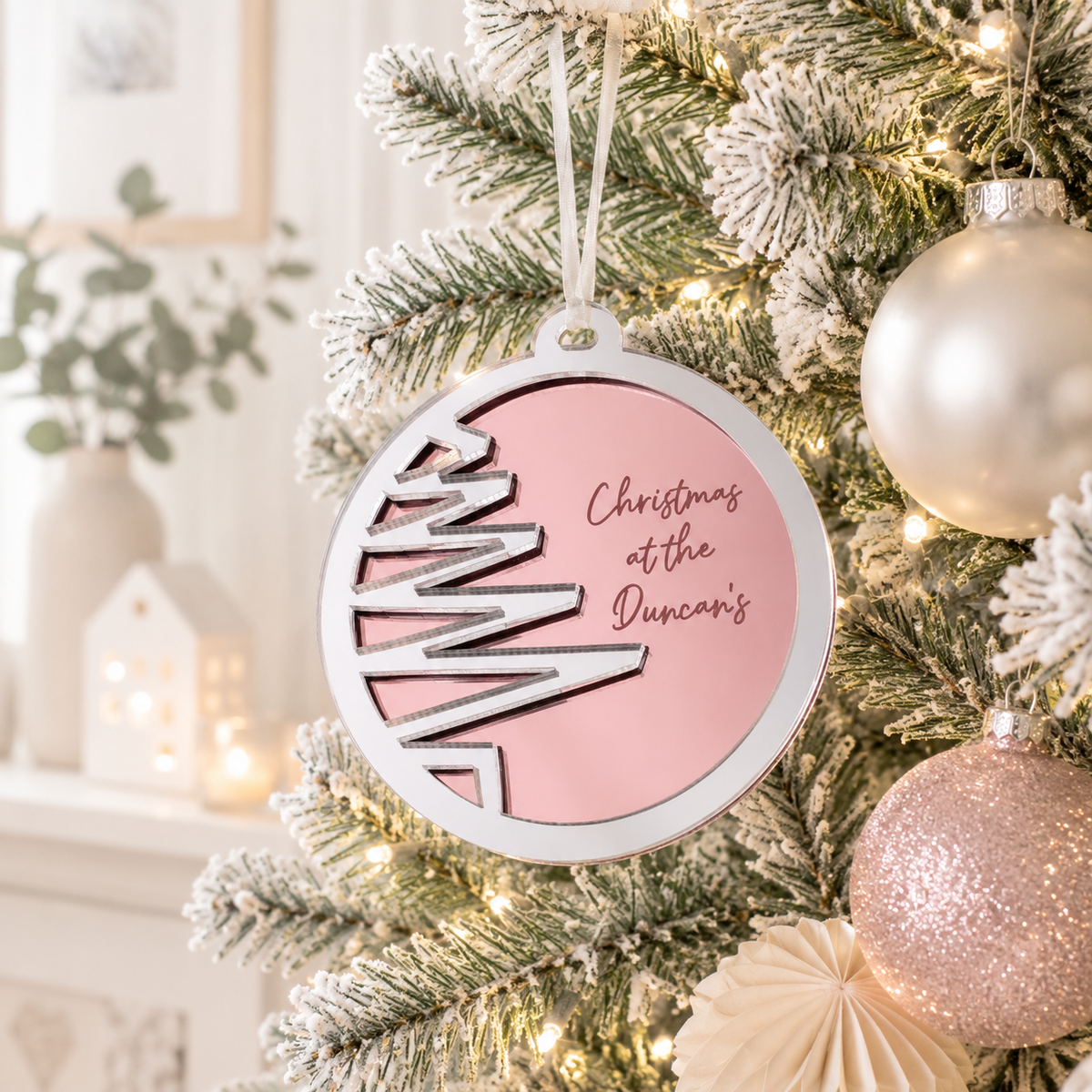Personalised pink and silver mirror acrylic Christmas bauble with custom family name and Christmas tree design, modern Christmas tree ornament.