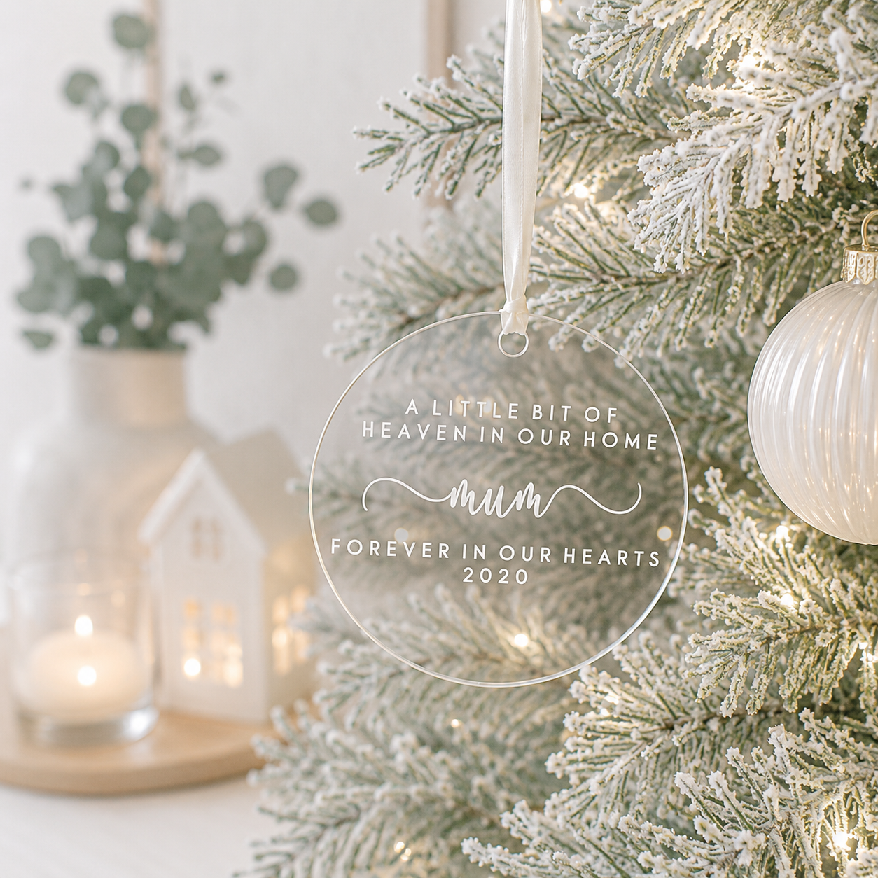 Personalised clear acrylic memorial Christmas bauble for Mum with “A Little Bit of Heaven in Our Home” and “Forever in Our Hearts” design.
