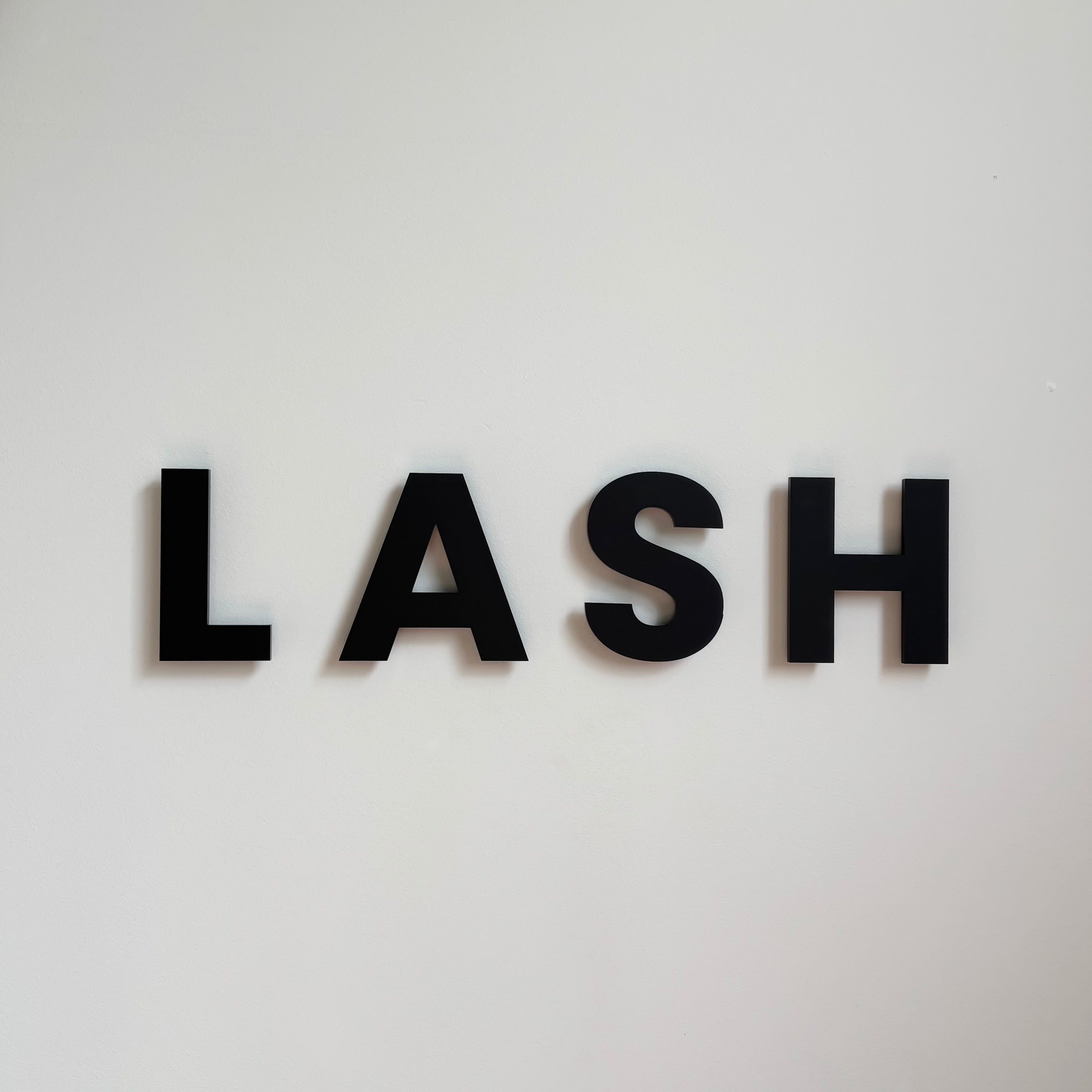 black acrylic lettering wall sign floating 3D business signage bold modern logo display for beauty salon interior