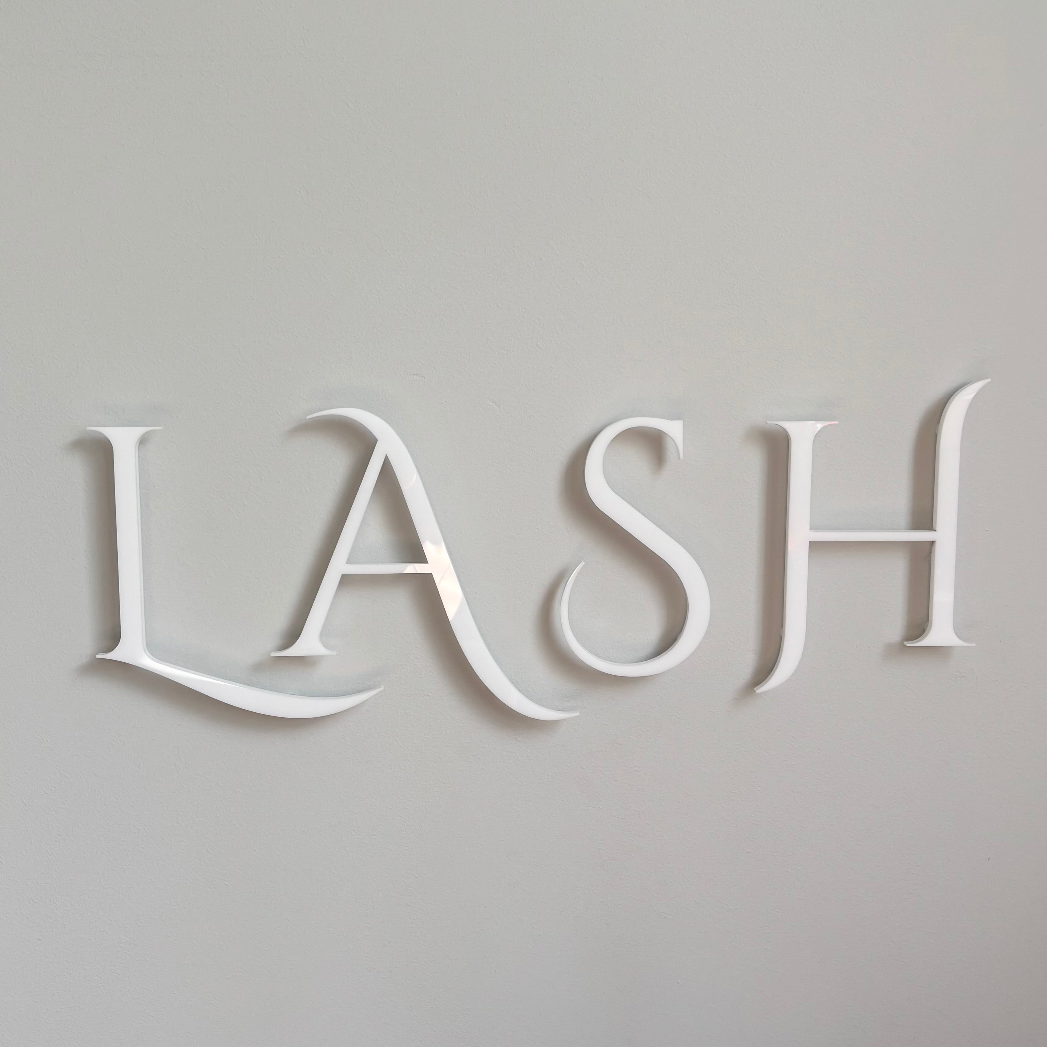 white acrylic lettering sign floating 3D wall mounted business logo signage clean modern salon branding display