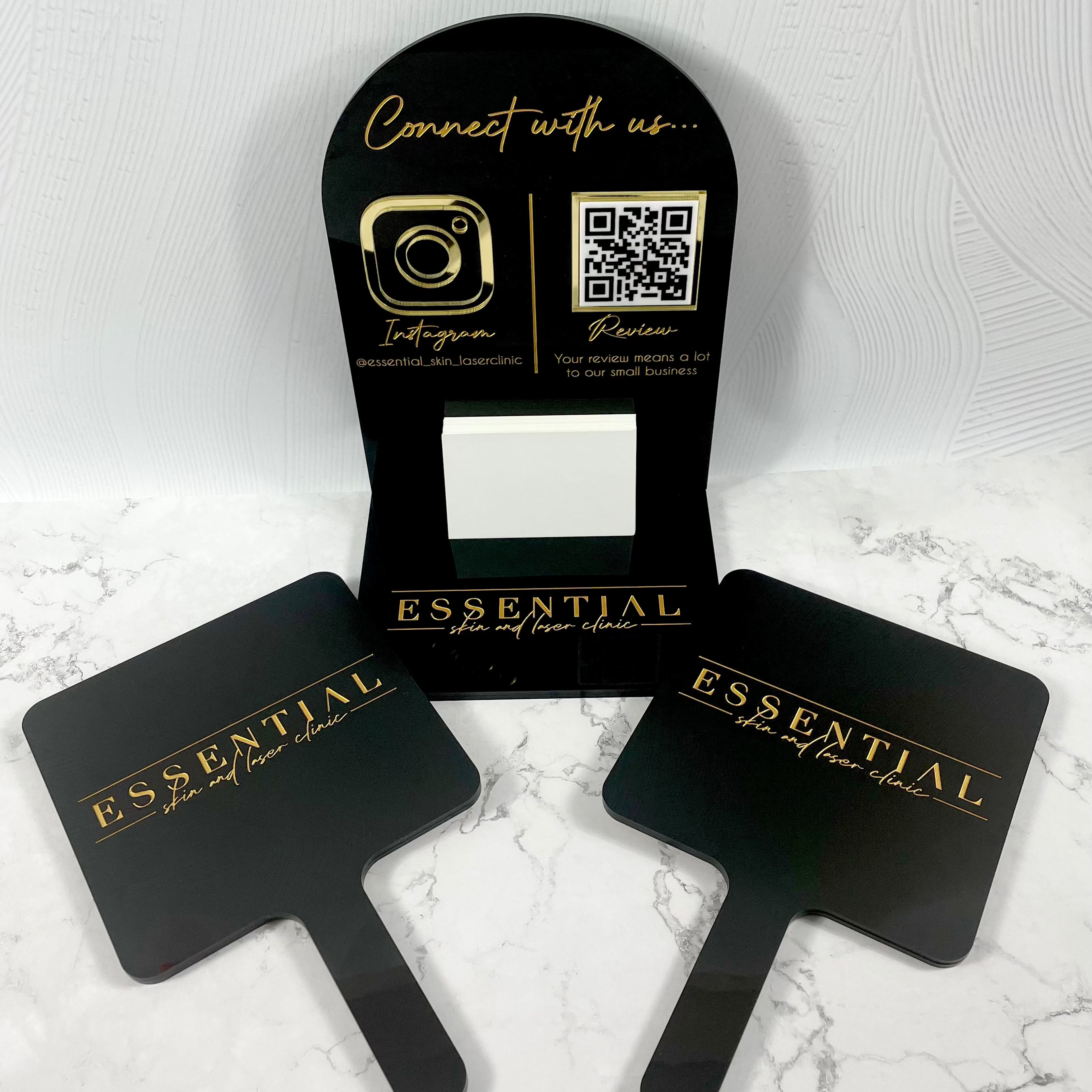 Black acrylic QR and Instagram display stands with gold text branding