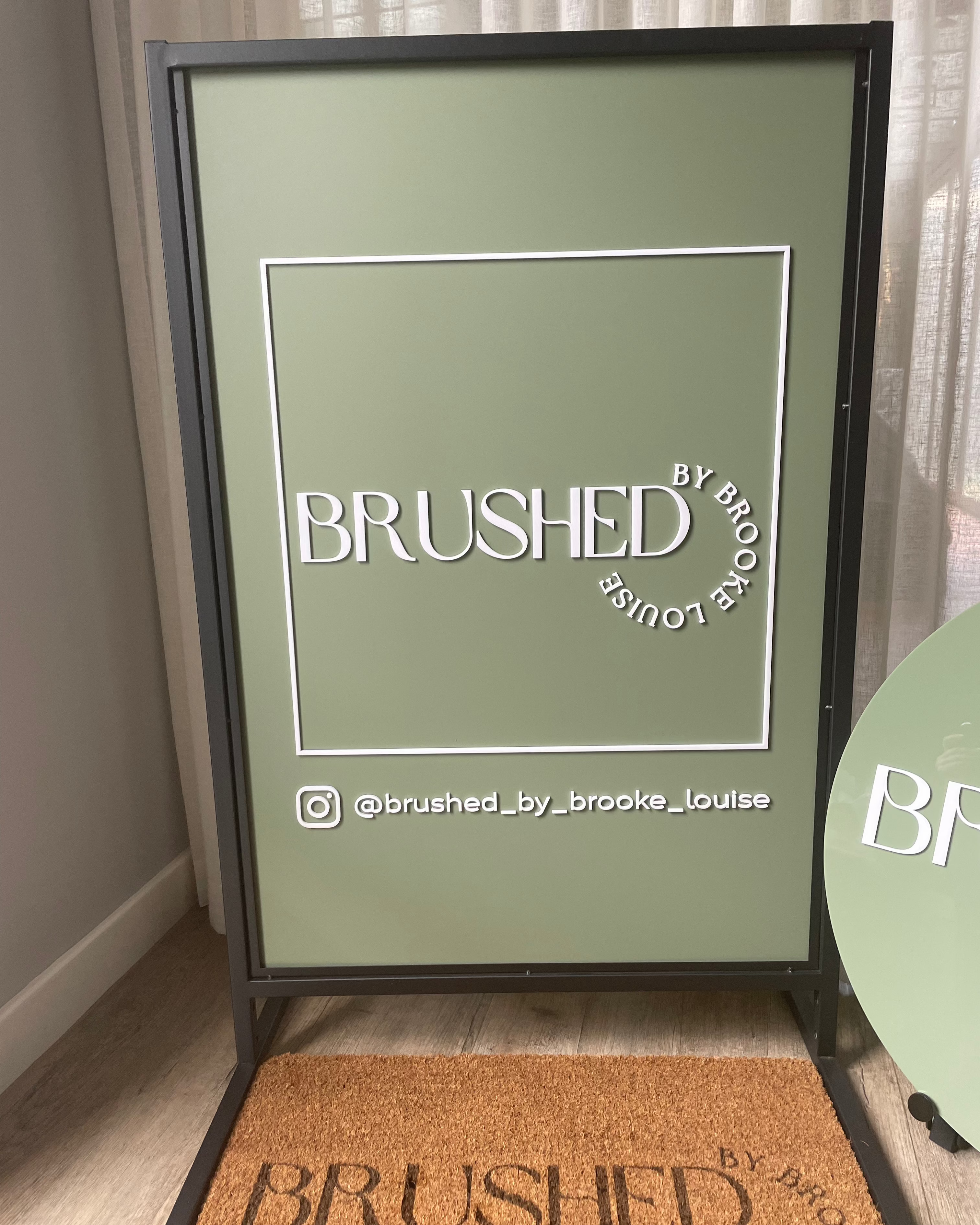 Green T frame outdoor sign with modern acrylic design