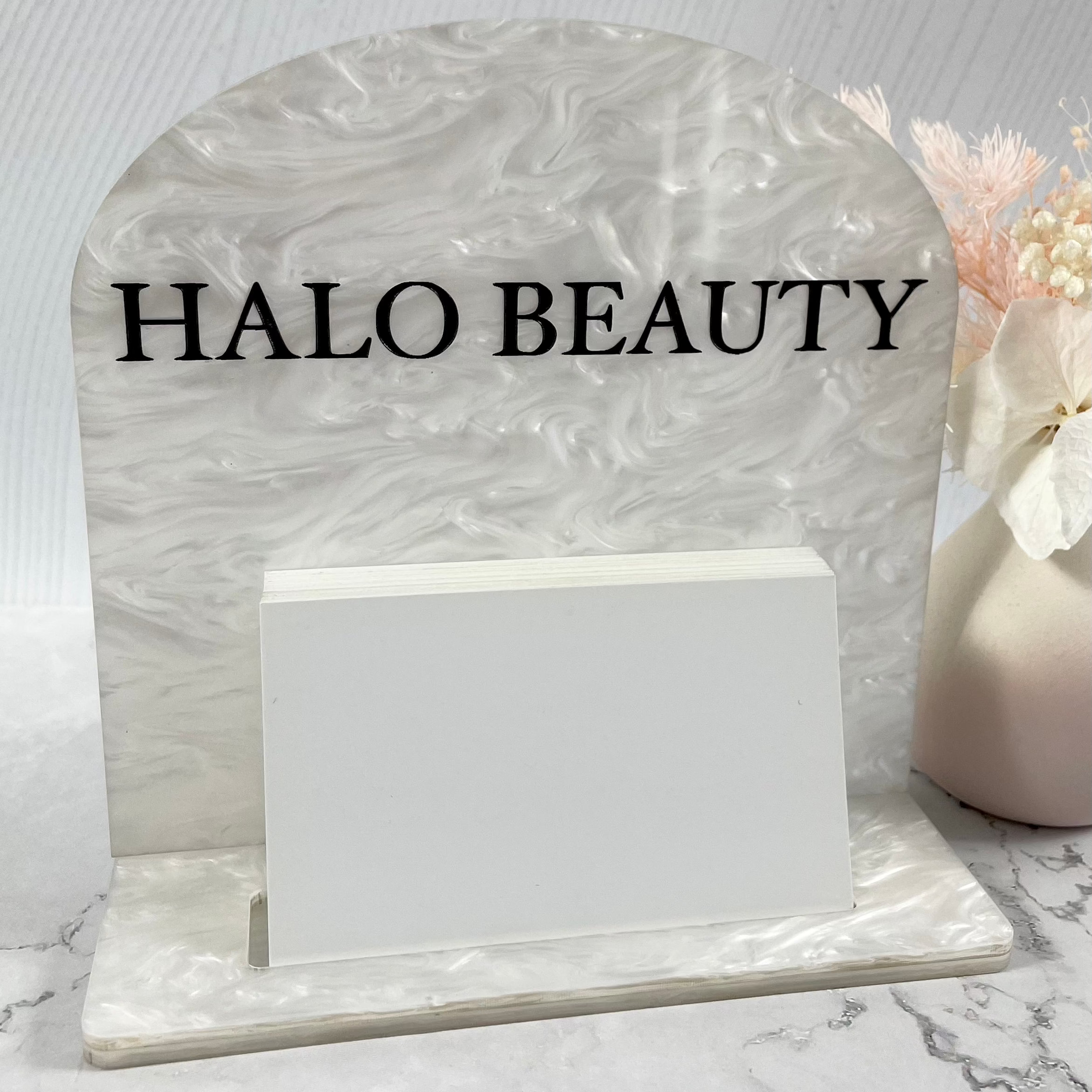 Marble base card holder with Halo Beauty logo in acrylic