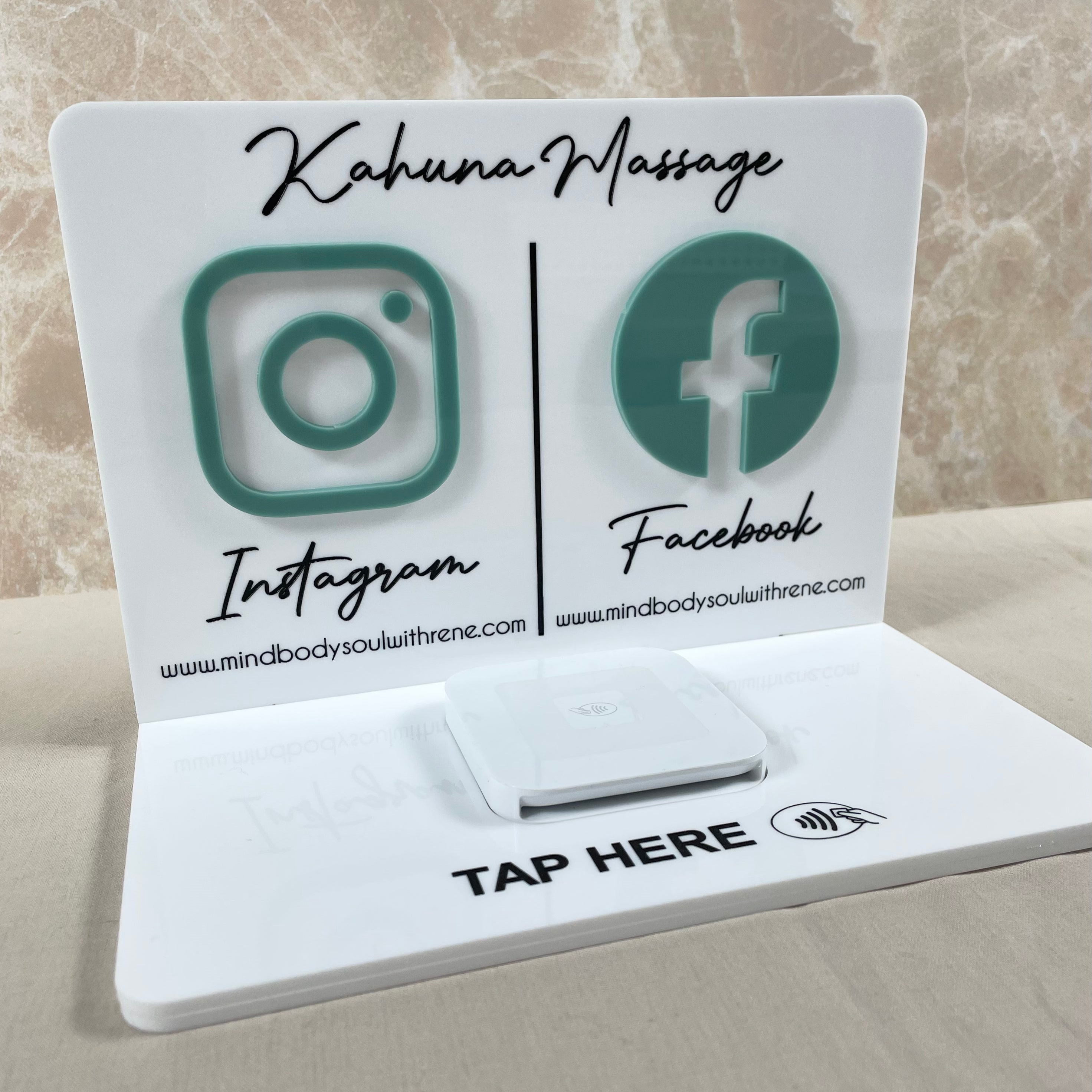 Green and white acrylic stand with Instagram and Facebook logos