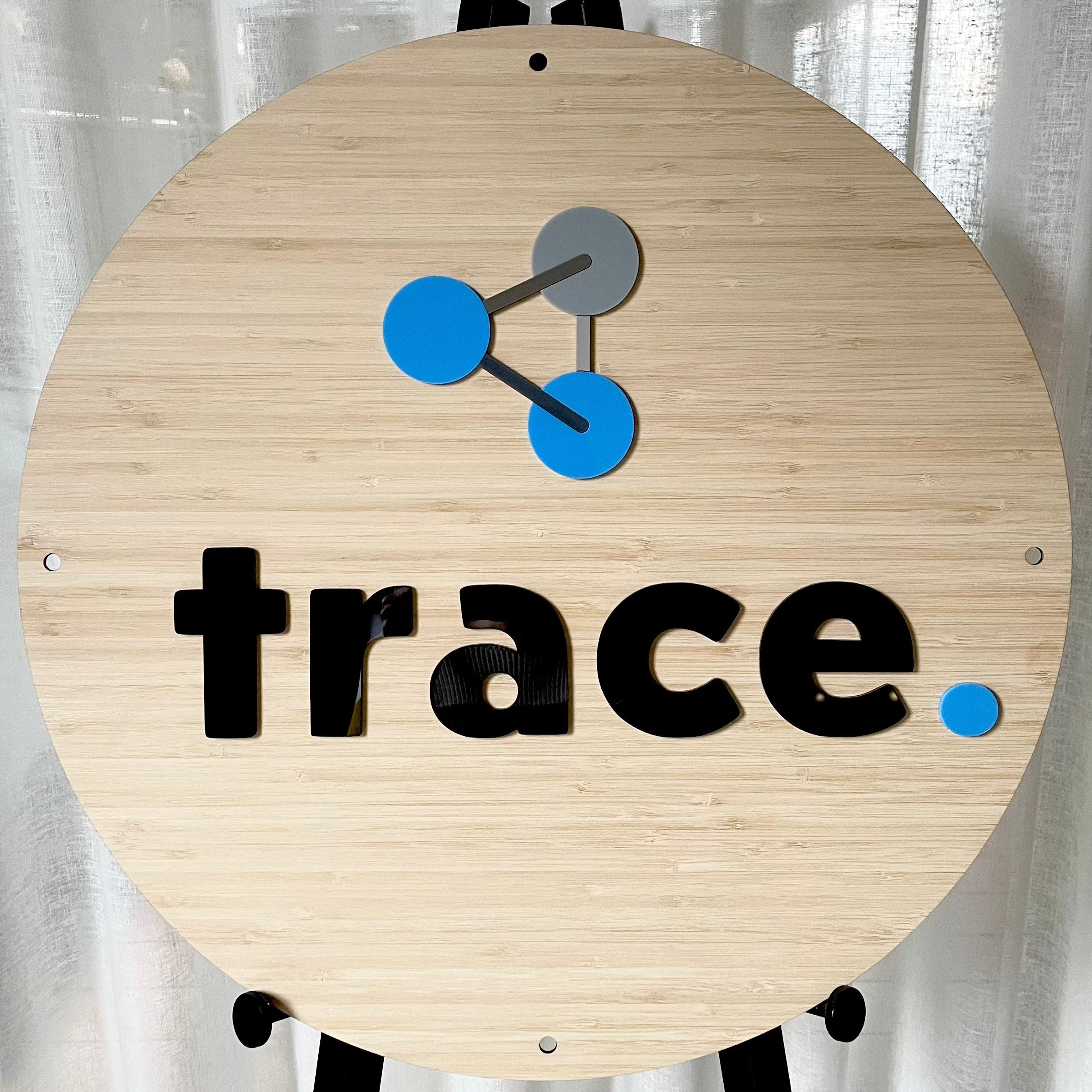 Trace. bamboo sign with blue and grey science themed acrylic elements