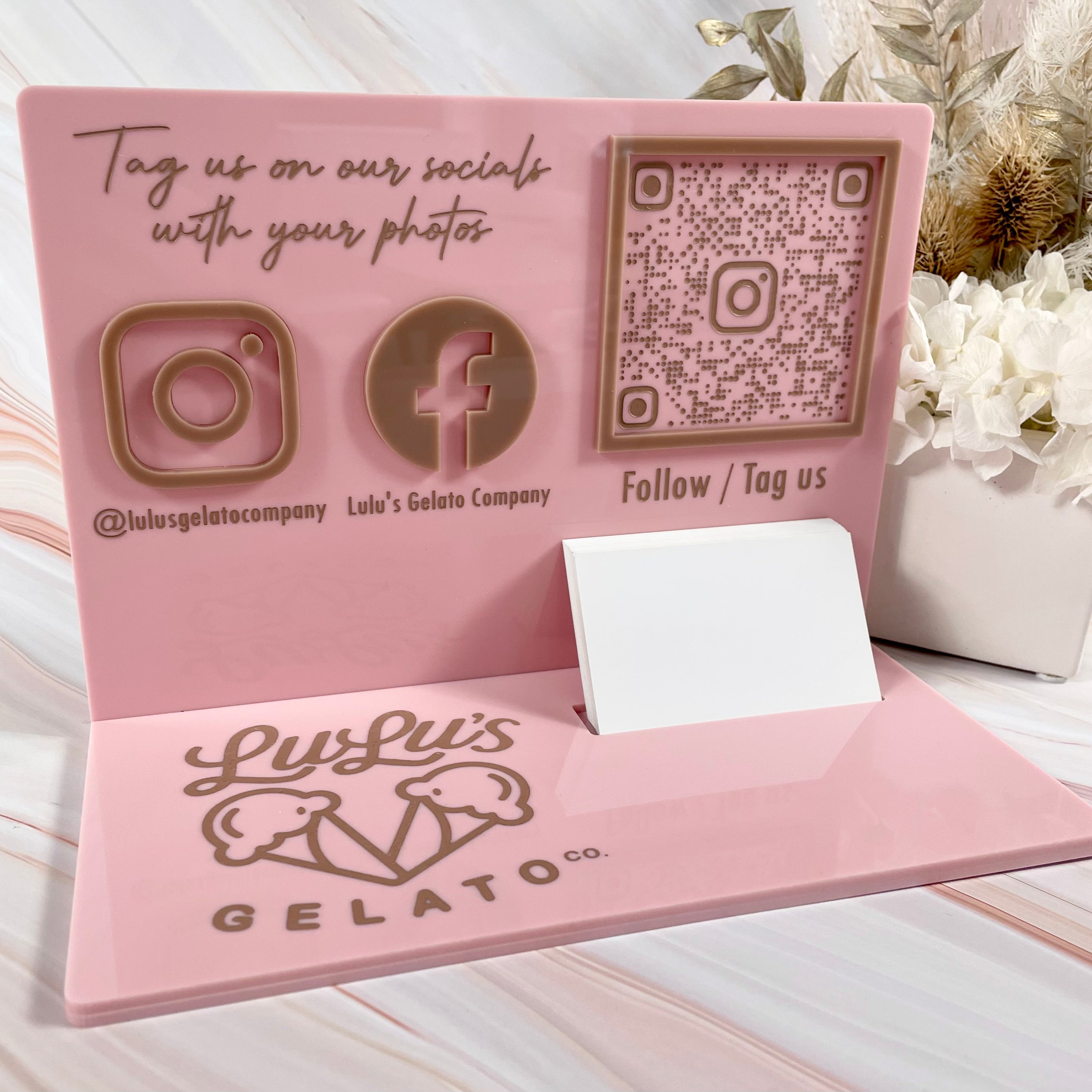 Acrylic stand for Lulu’s Gelato with pink background and social QR code