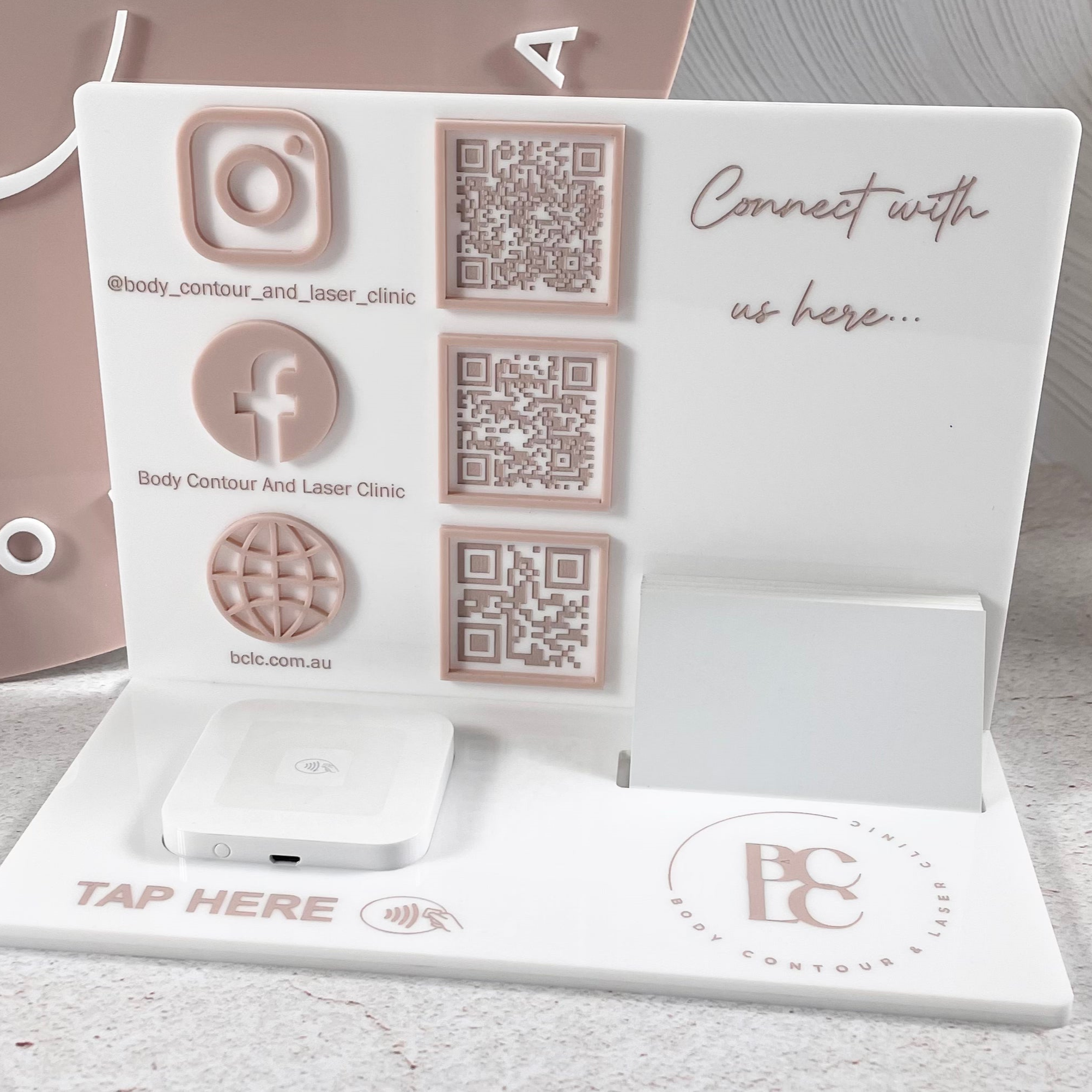 White acrylic stand with Instagram and Facebook engraving