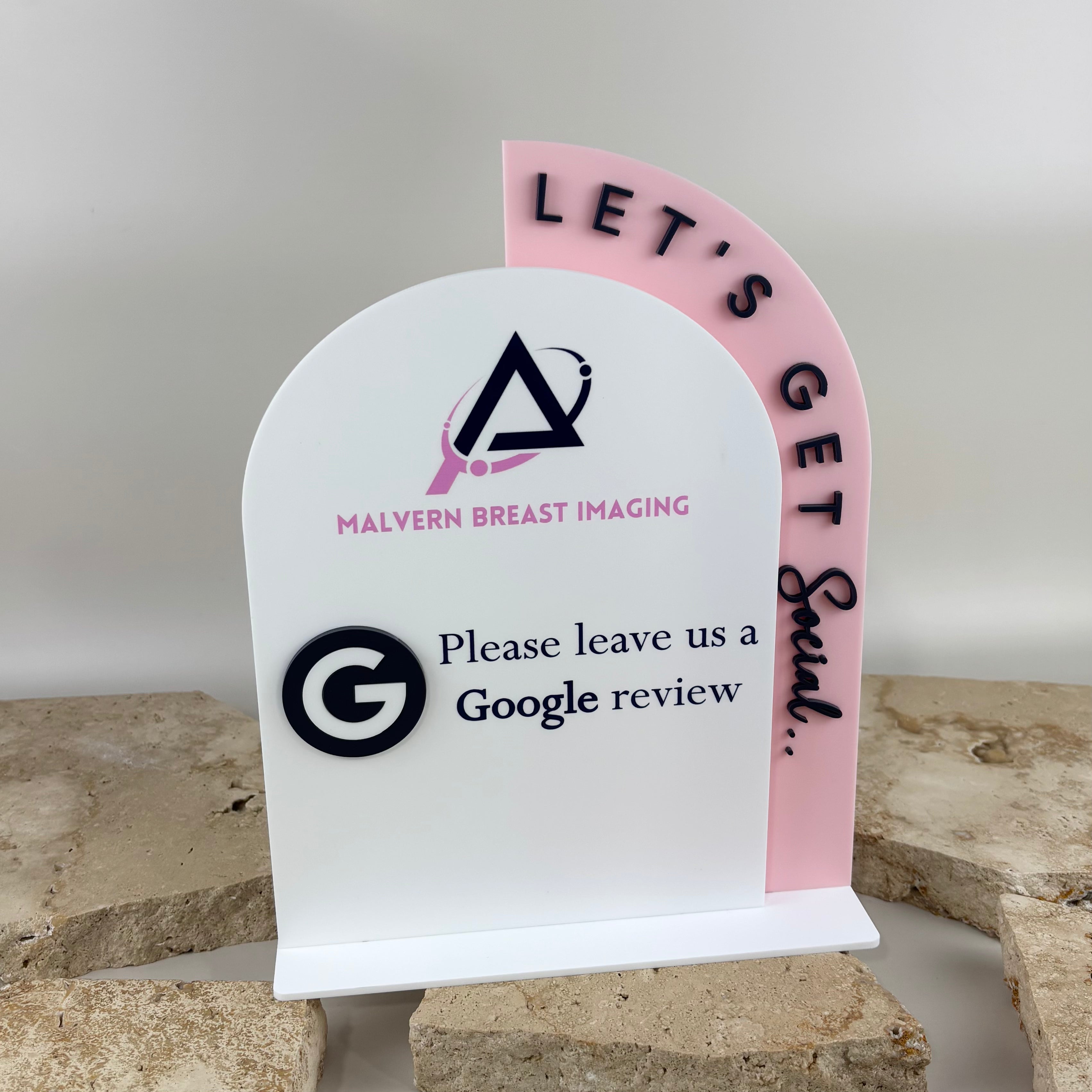 Custom acrylic Google review stand featuring business branding and a layered arch design, created for reception desks, clinics, salons and retail counters to encourage customer reviews.