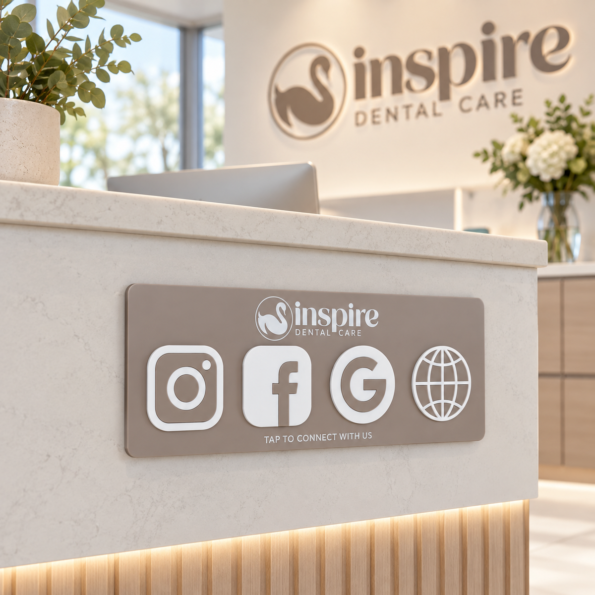 Custom acrylic NFC social media plaque for a dental clinic, mounted to the front of a reception counter with Instagram, Facebook, Google and website tap-to-connect icons.