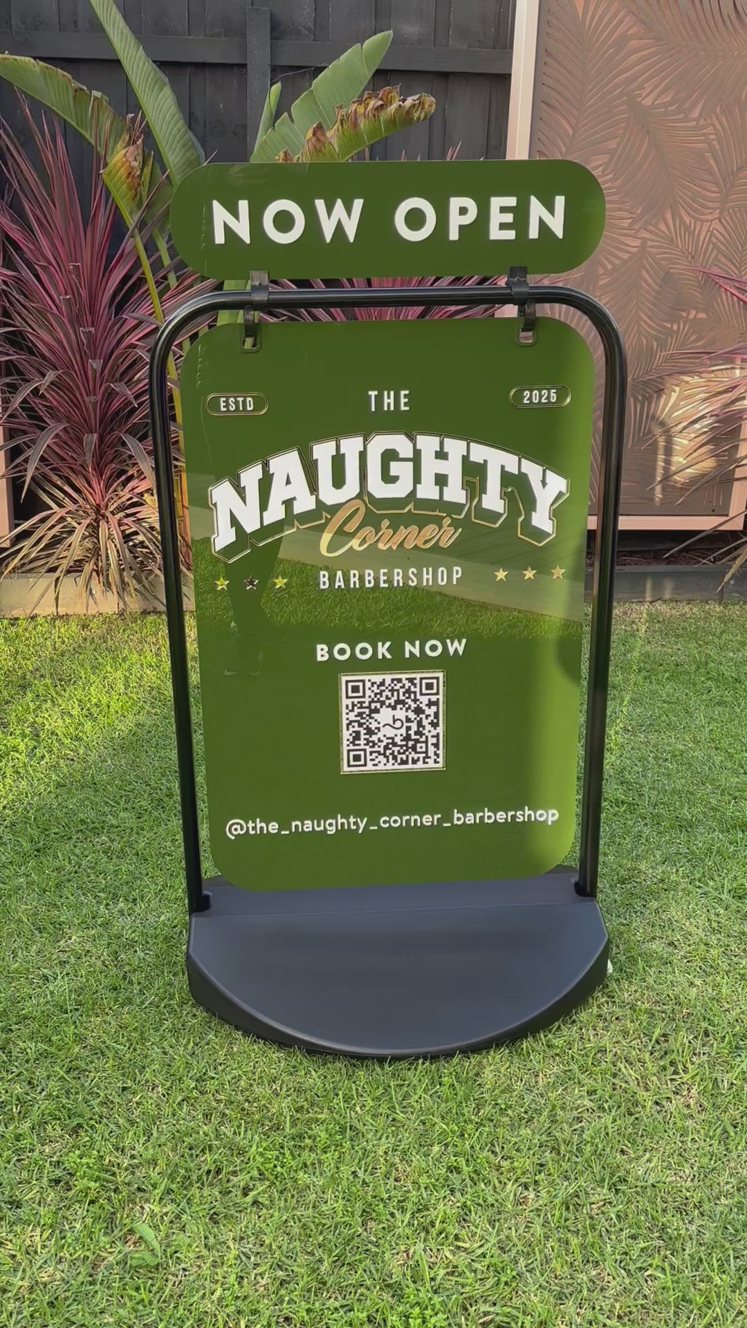 Outdoor custom swing sign in green acrylic with business branding. Video