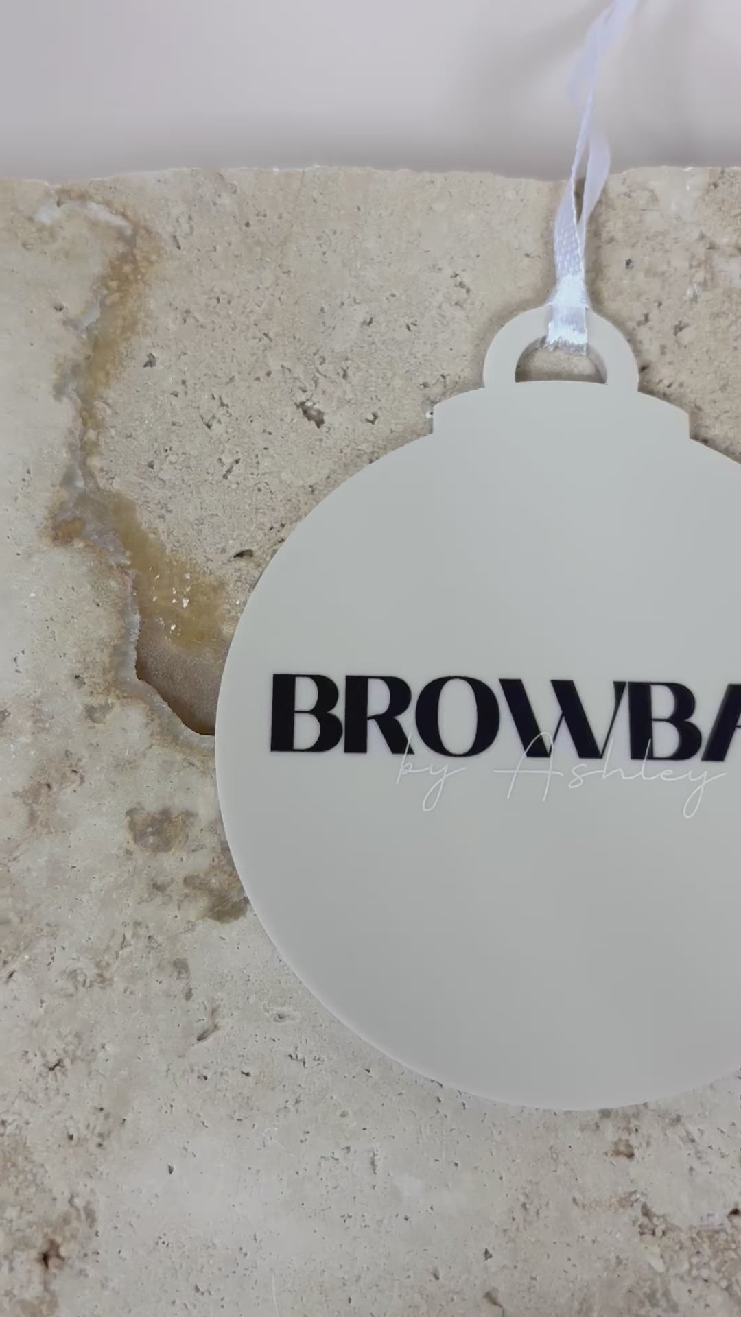 Personalised white acrylic Christmas bauble with custom business logo. Video