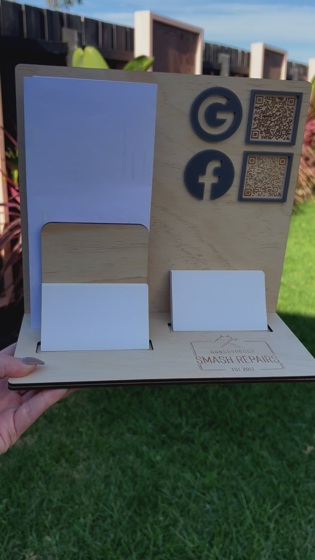 Timber business counter display with Square reader and social media icons. Video