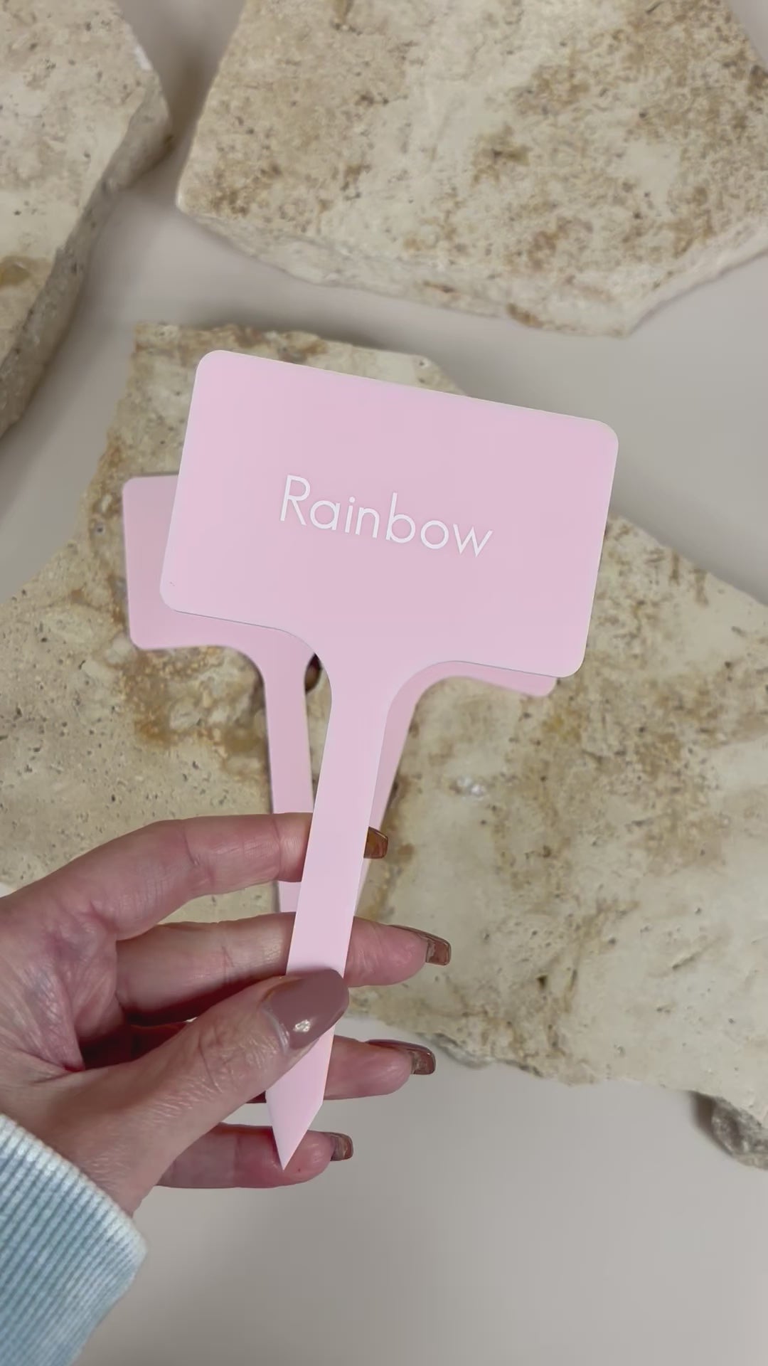 Video Close up of pink acrylic food marker stick with engraved logo